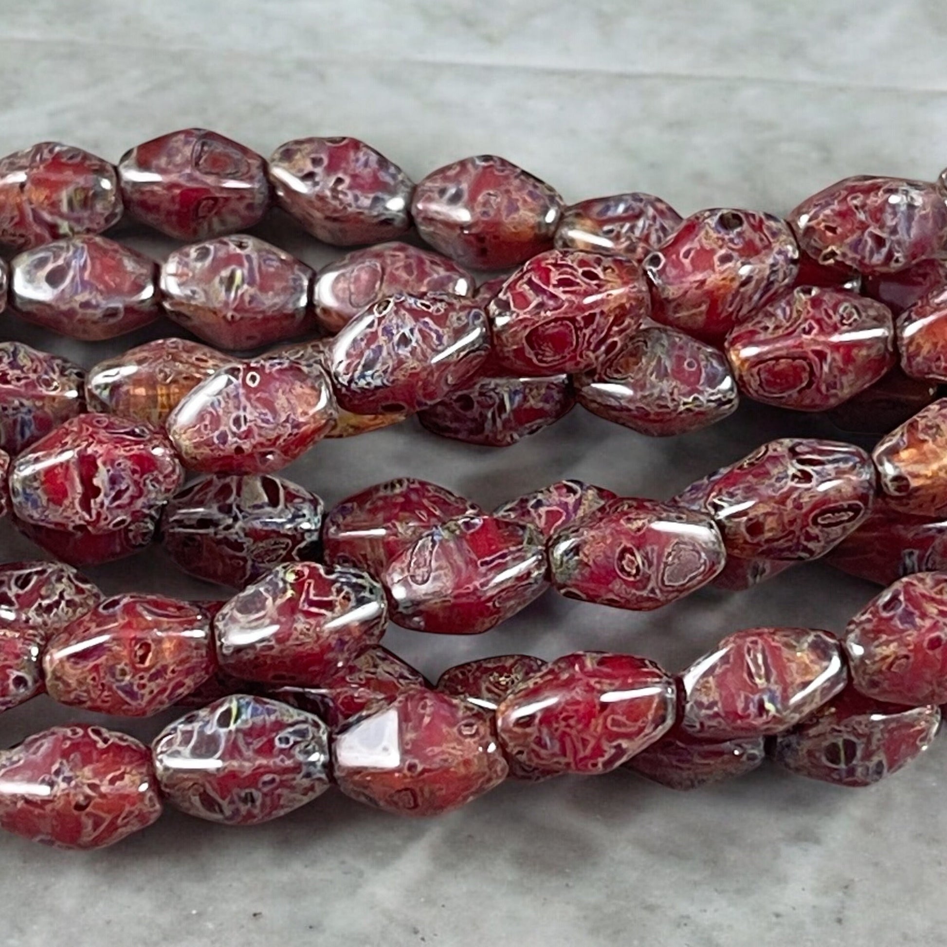 Transparent Crystal Red with Travertine Picasso , 8x6mm Dark Red, Rustic Picasso, Elongated Bicone (EB5) * Qty. 16