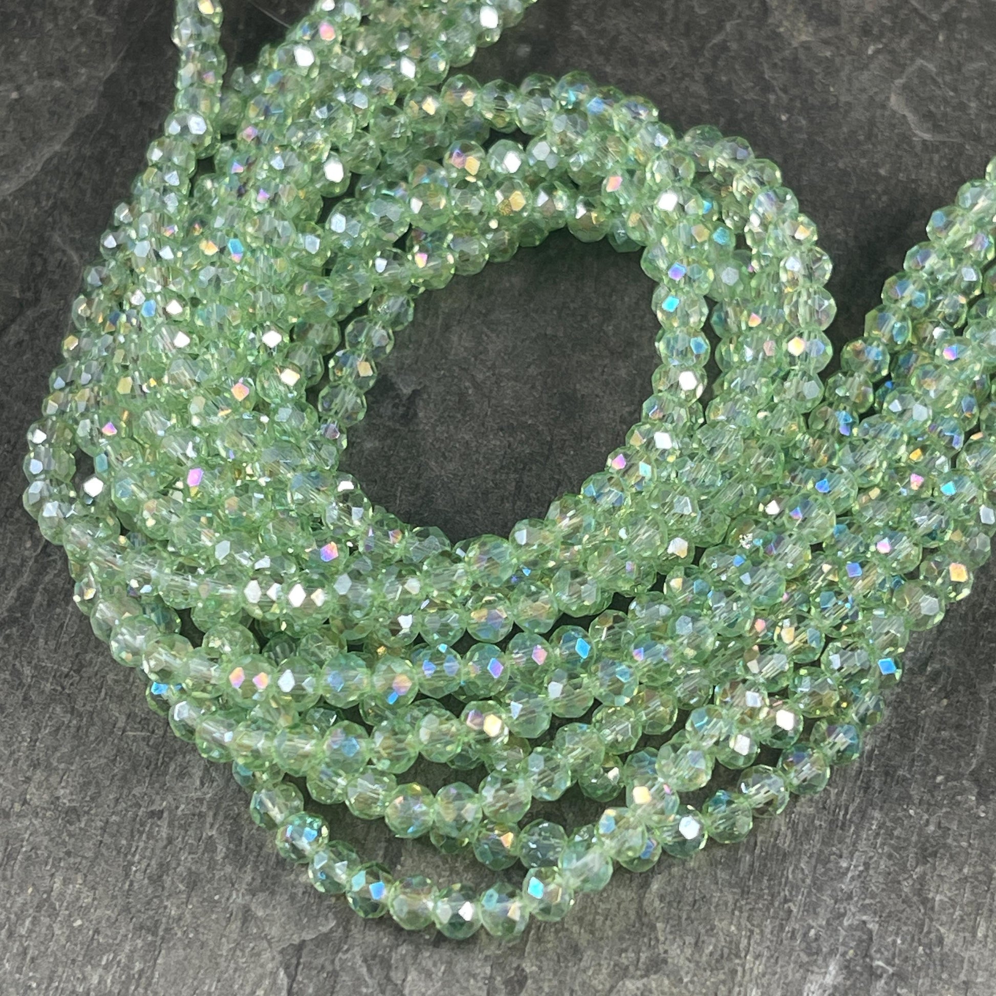 Transparent Light Green 4x3mm Faceted Glass Beads, Pastel Green with AB Finish (LtGreenAB-4) * 100 Beads
