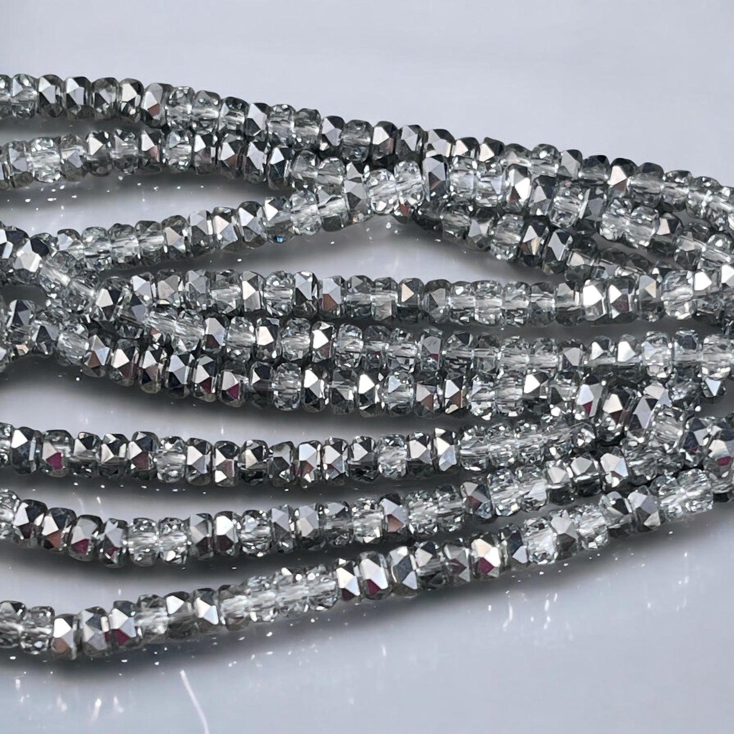 Faceted Glass Beads - 4x2.5mm Heishi Rondelles, Crystal Clear with Silver Half Tone (Silver) * 7" Strand
