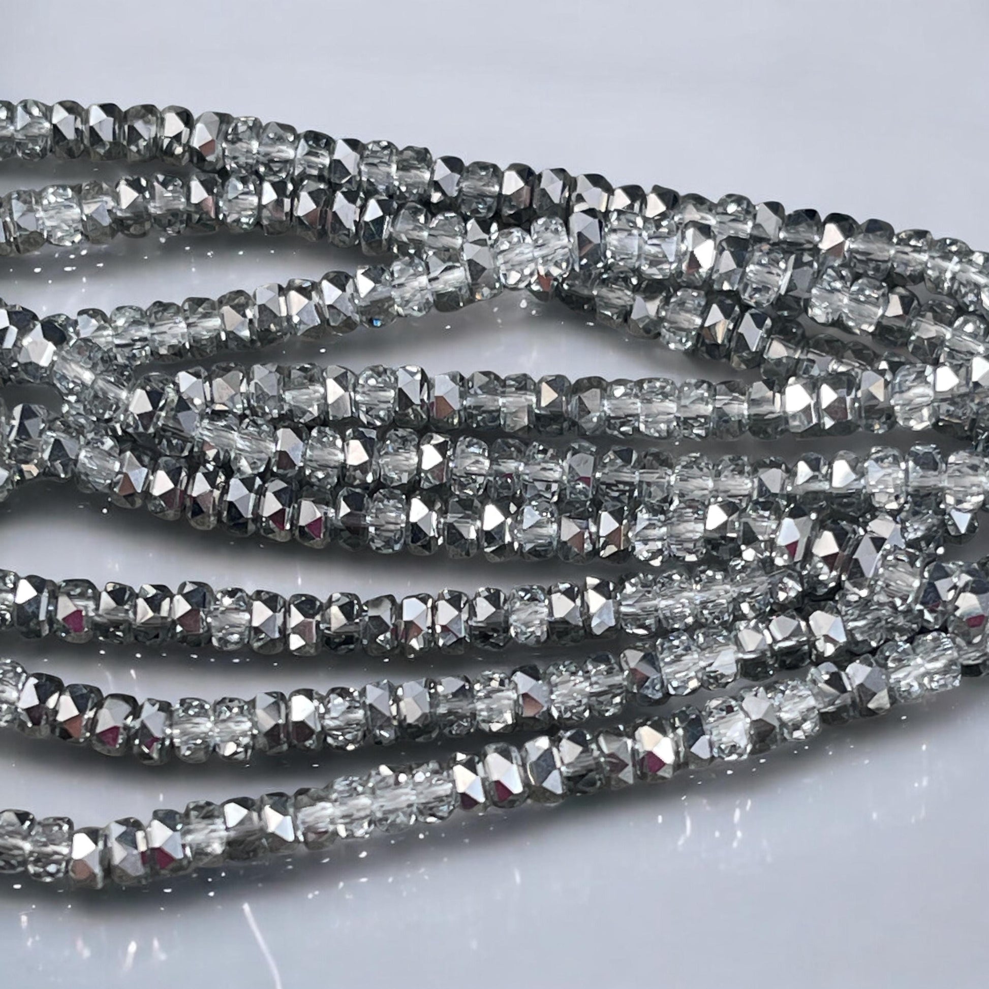Faceted Glass Beads - 4x2.5mm Heishi Rondelles, Crystal Clear with Silver Half Tone (Silver) * 7" Strand