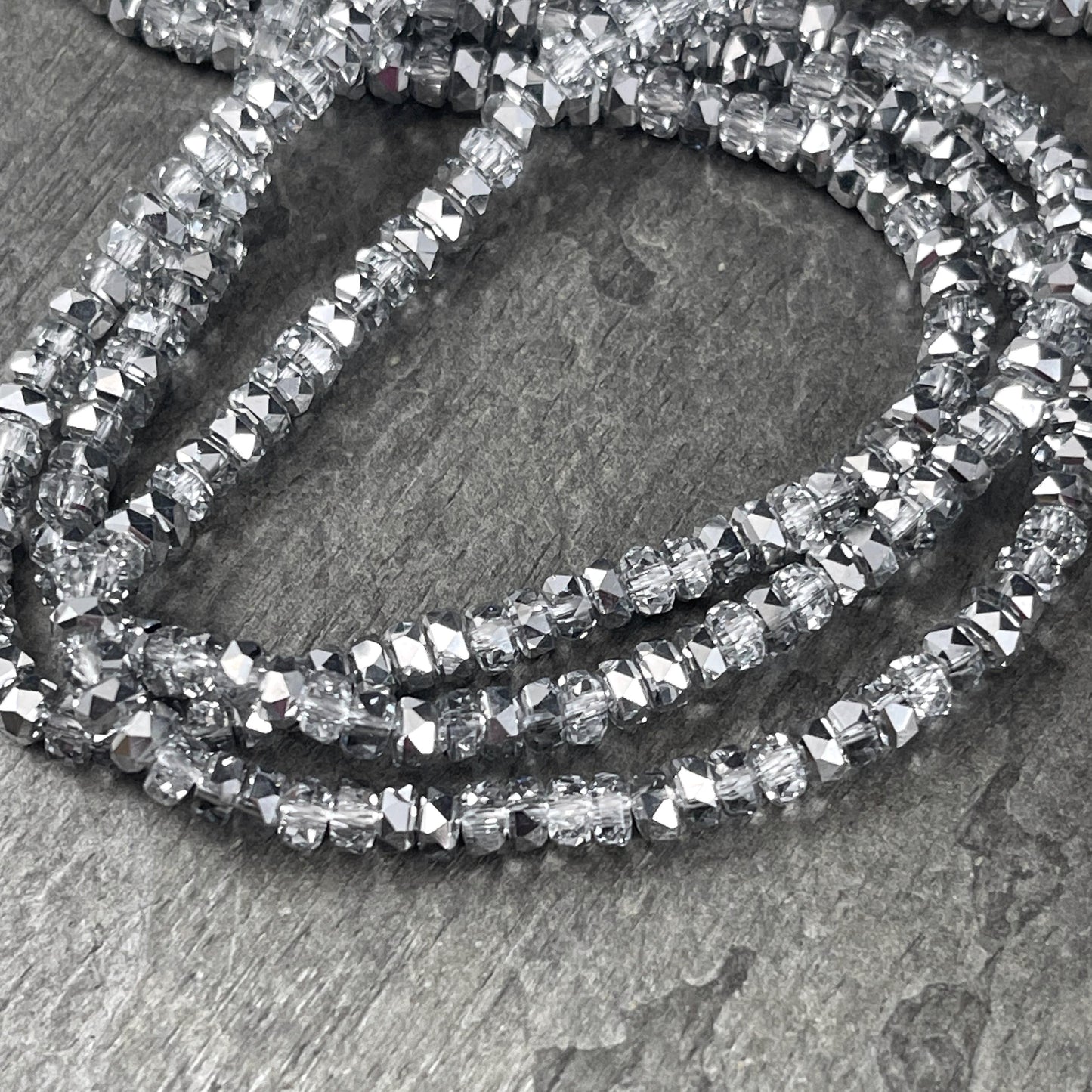 Faceted Glass Beads - 4x2.5mm Heishi Rondelles, Crystal Clear with Silver Half Tone (Silver) * 7" Strand