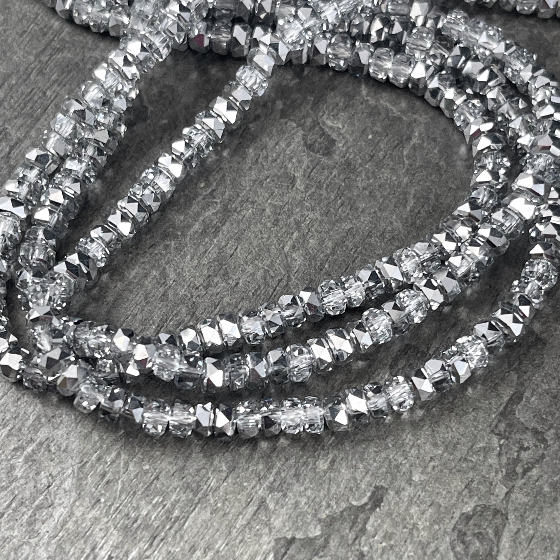 Faceted Glass Beads - 4x2.5mm Heishi Rondelles, Crystal Clear with Silver Half Tone (Silver) * 7" Strand