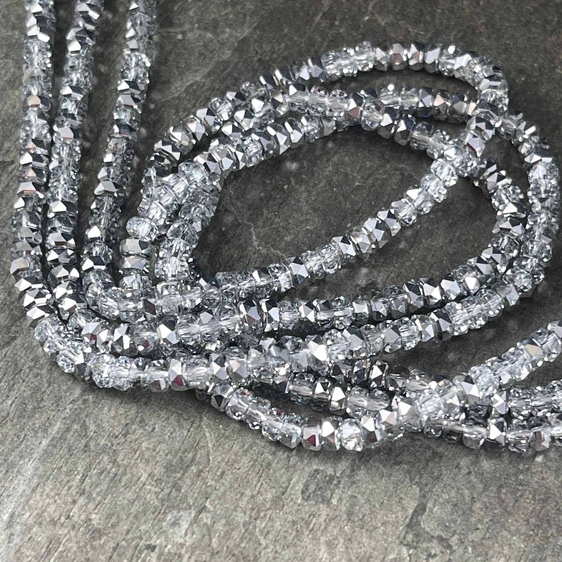 Faceted Glass Beads - 4x2.5mm Heishi Rondelles, Crystal Clear with Silver Half Tone (Silver) * 7" Strand