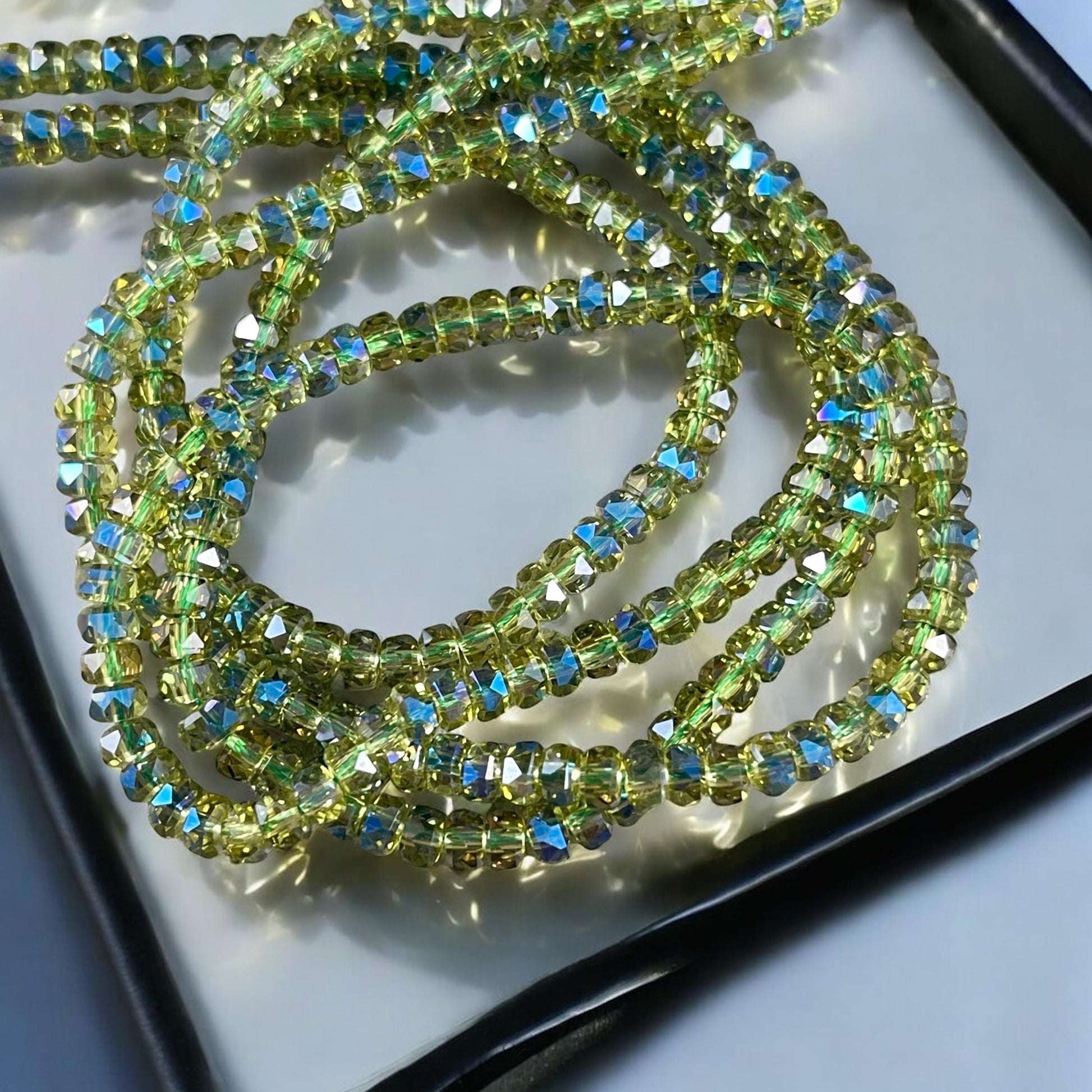 Faceted Glass Beads - 4x2.5mm Heishi Rondelles, Transparent Olive Green with Rainbow AB Finish (Peridot-AB) * 7" Strand