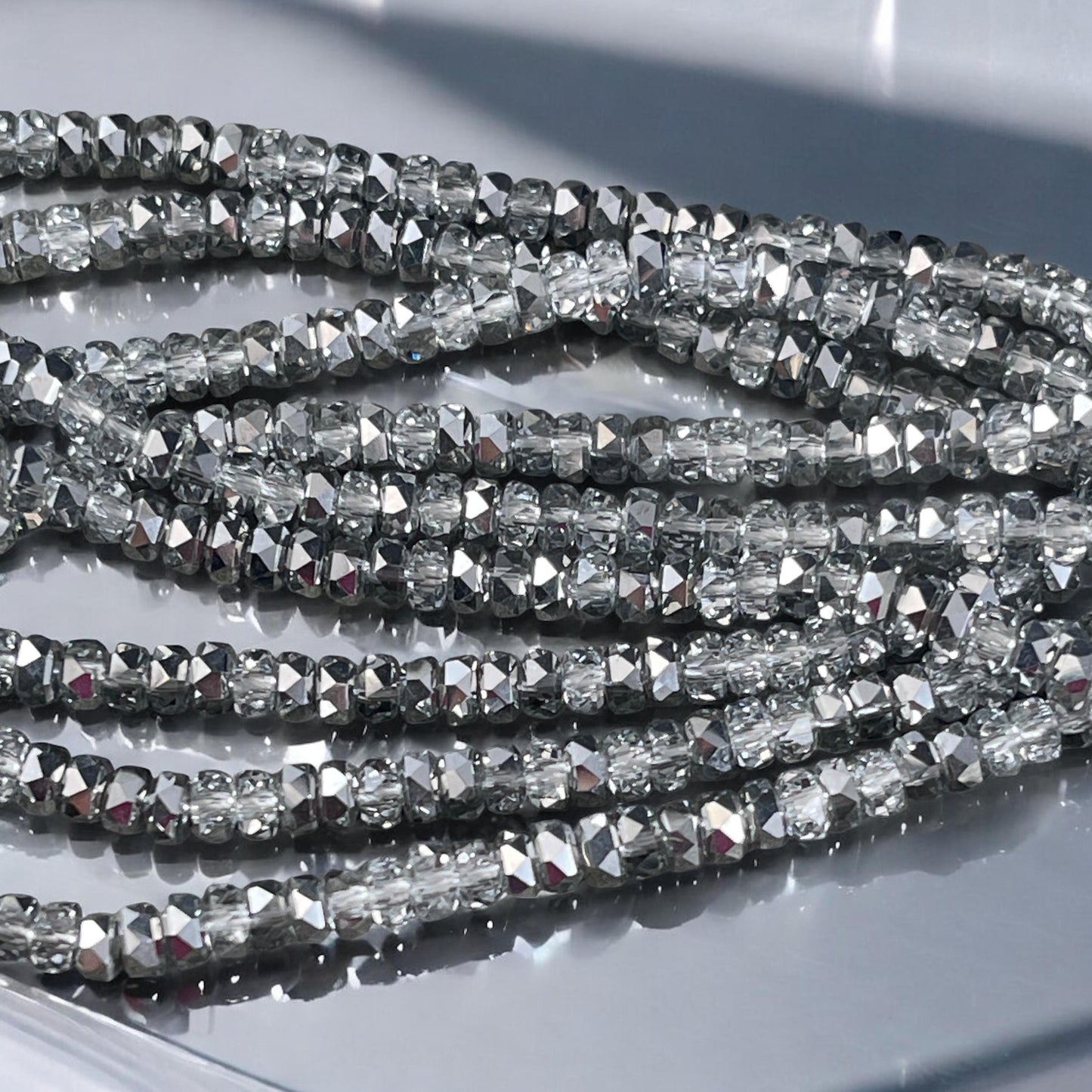 Faceted Glass Beads - 4x2.5mm Heishi Rondelles, Crystal Clear with Silver Half Tone (Silver) * 7" Strand