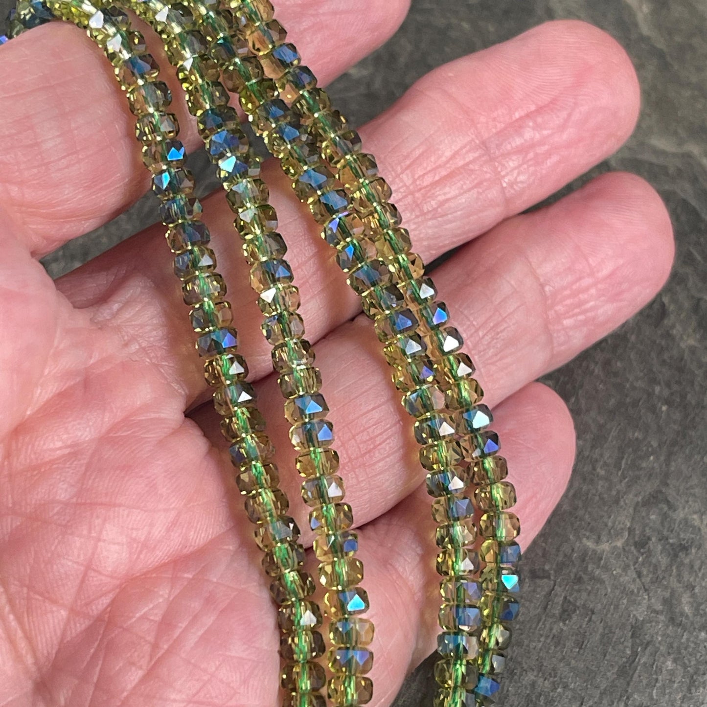 Faceted Glass Beads - 4x2.5mm Heishi Rondelles, Transparent Olive Green with Rainbow AB Finish (Olive-AB) * 7" Strand