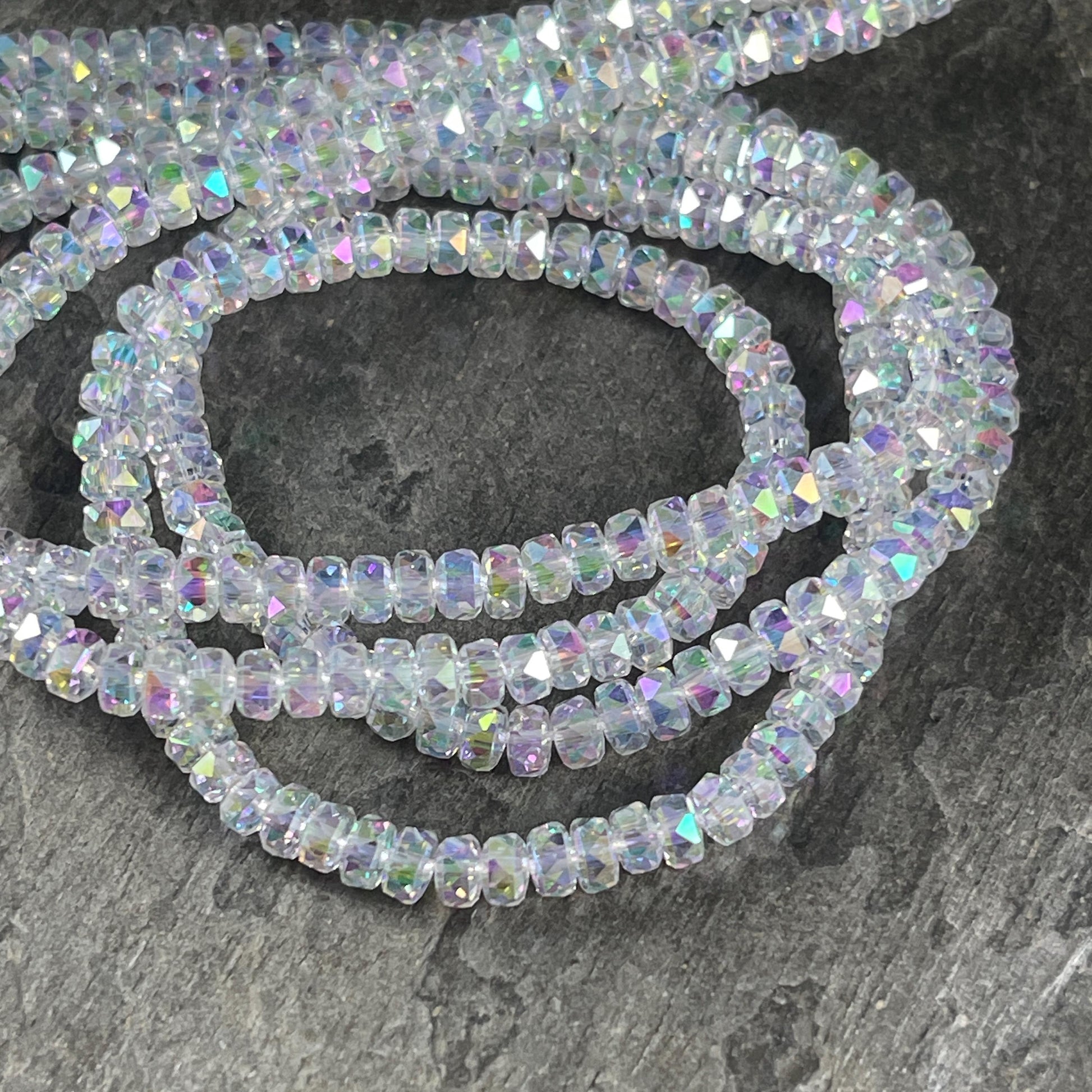 Faceted Glass Beads - 4x2.5mm Heishi Rondelles, Milky Crystal with AB Finish (Crystal AB) * 7" Strand