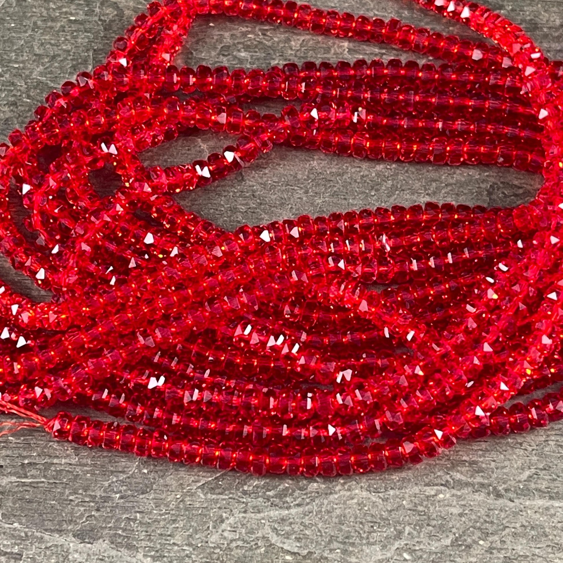Faceted Glass Beads - 4x2.5mm Heishi Rondelles, Siam Transparent Red (Siam) * 7" Strand