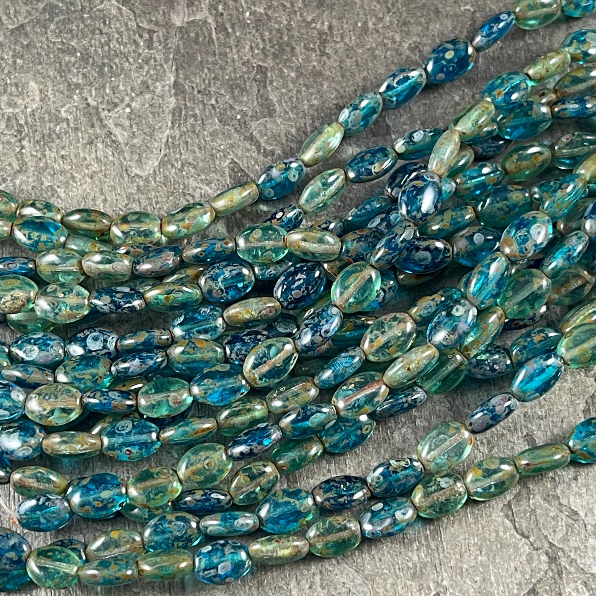 Czech Glass Beads - 9x6mm Oval, Capri Blue and Aqua Picasso (GlossOval) * 24 Beads