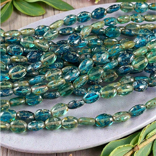 Czech Glass Beads - 9x6mm Oval, Capri Blue and Aqua Picasso (GlossOval) * 24 Beads