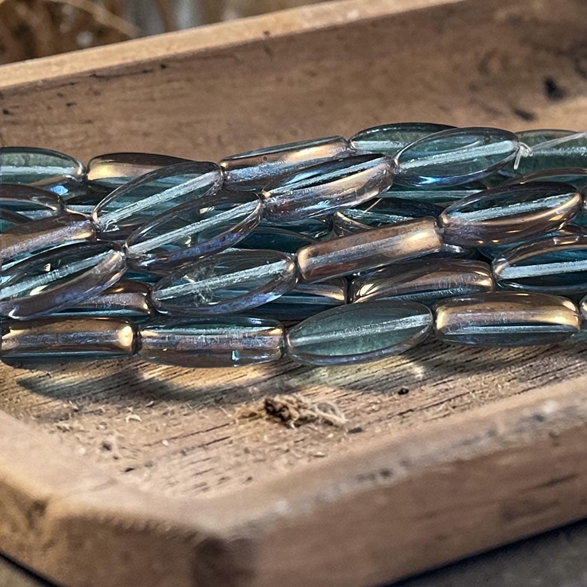Czech Glass Beads - 16x6mm Table Cut Spindle, Transparent Blue with Bronze Picasso (Spndl-TB) * 8 Beads
