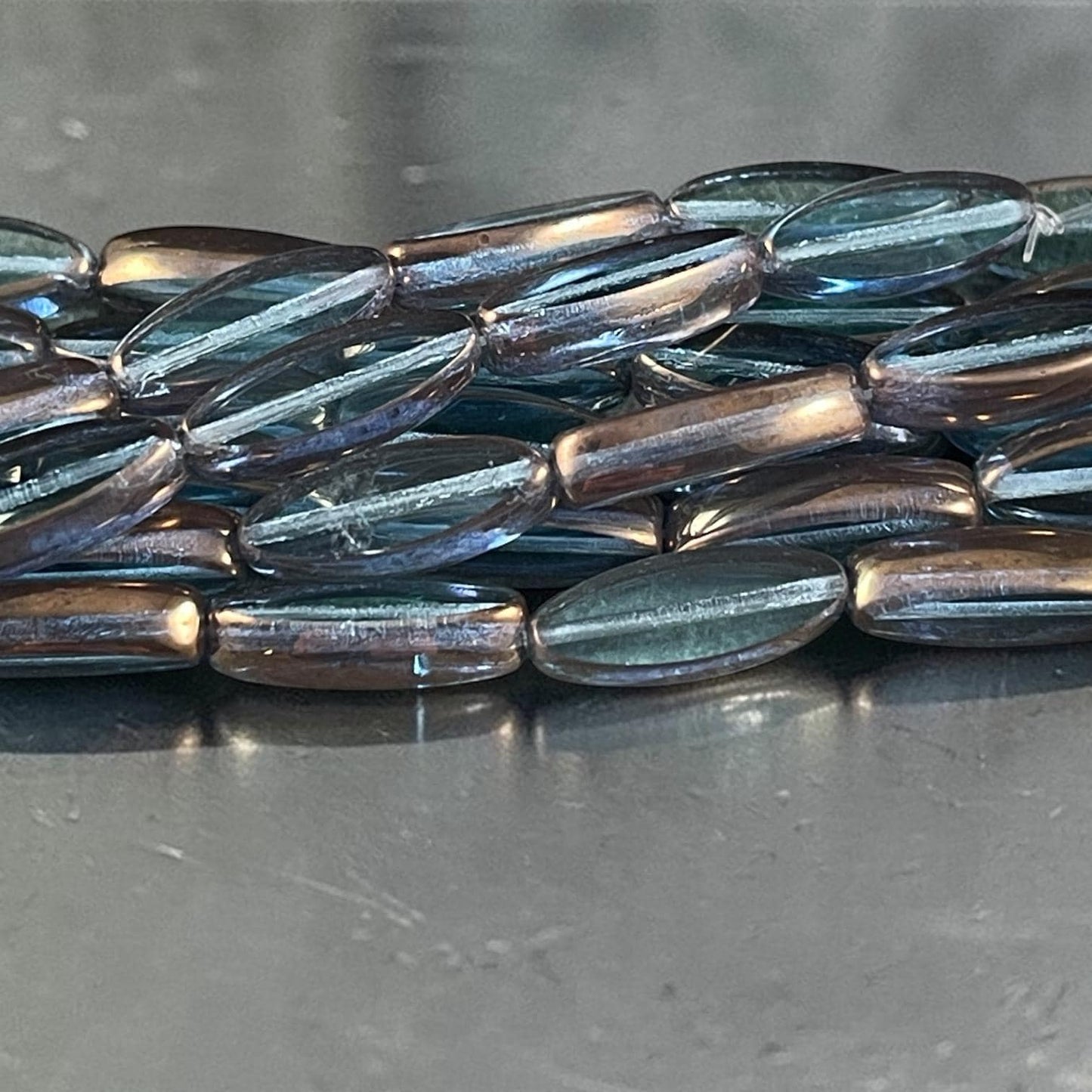 Czech Glass Beads - 16x6mm Table Cut Spindle, Transparent Blue with Bronze Picasso (Spndl-TB) * 8 Beads