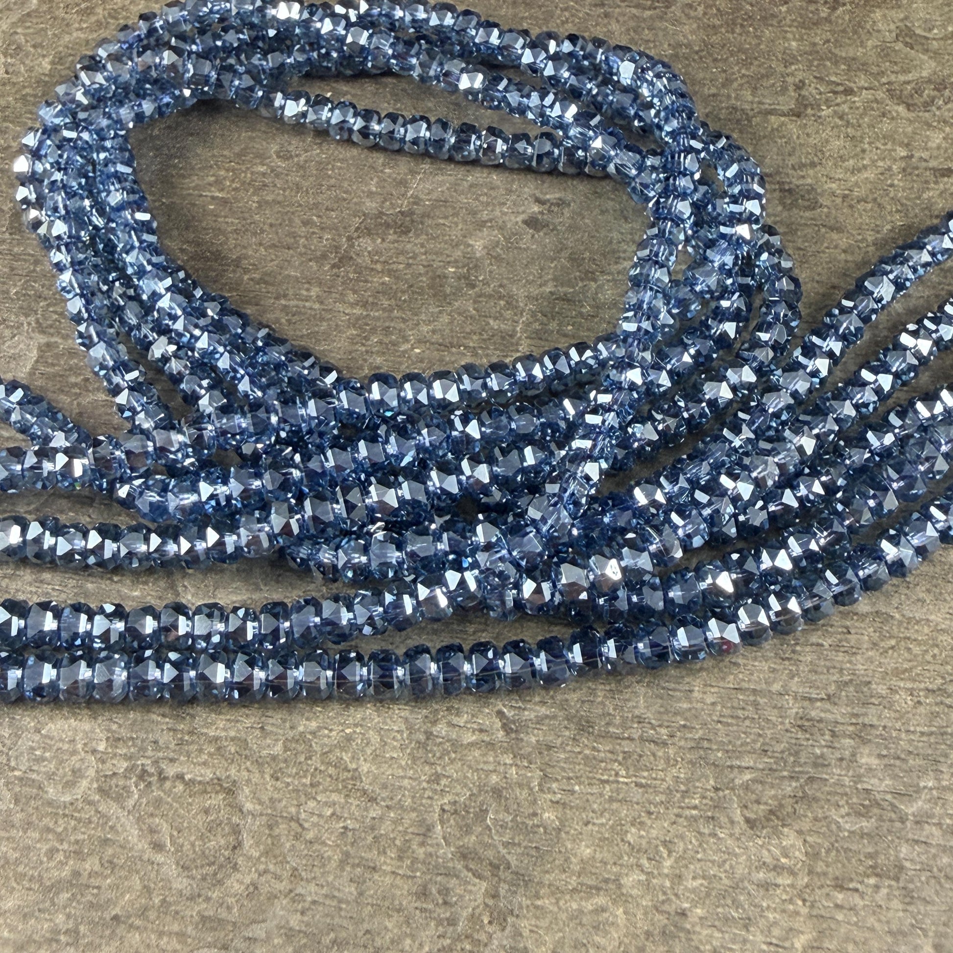 Faceted Glass Beads - 4x2.5mm Heishi Rondelles, Transparent Sapphire Blue (Sapphire) * 7" Strand