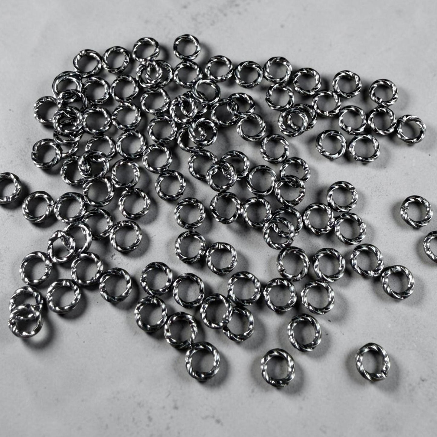 6mm Twisted Jump Rings, 16g Open, Gunmetal Black Plated Brass (FMG/5046) * Qty. 100