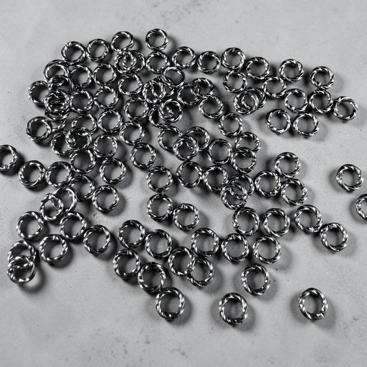 6mm Twisted Jump Rings, 16g Open, Gunmetal Black Plated Brass (FMG/5046) * Qty. 100