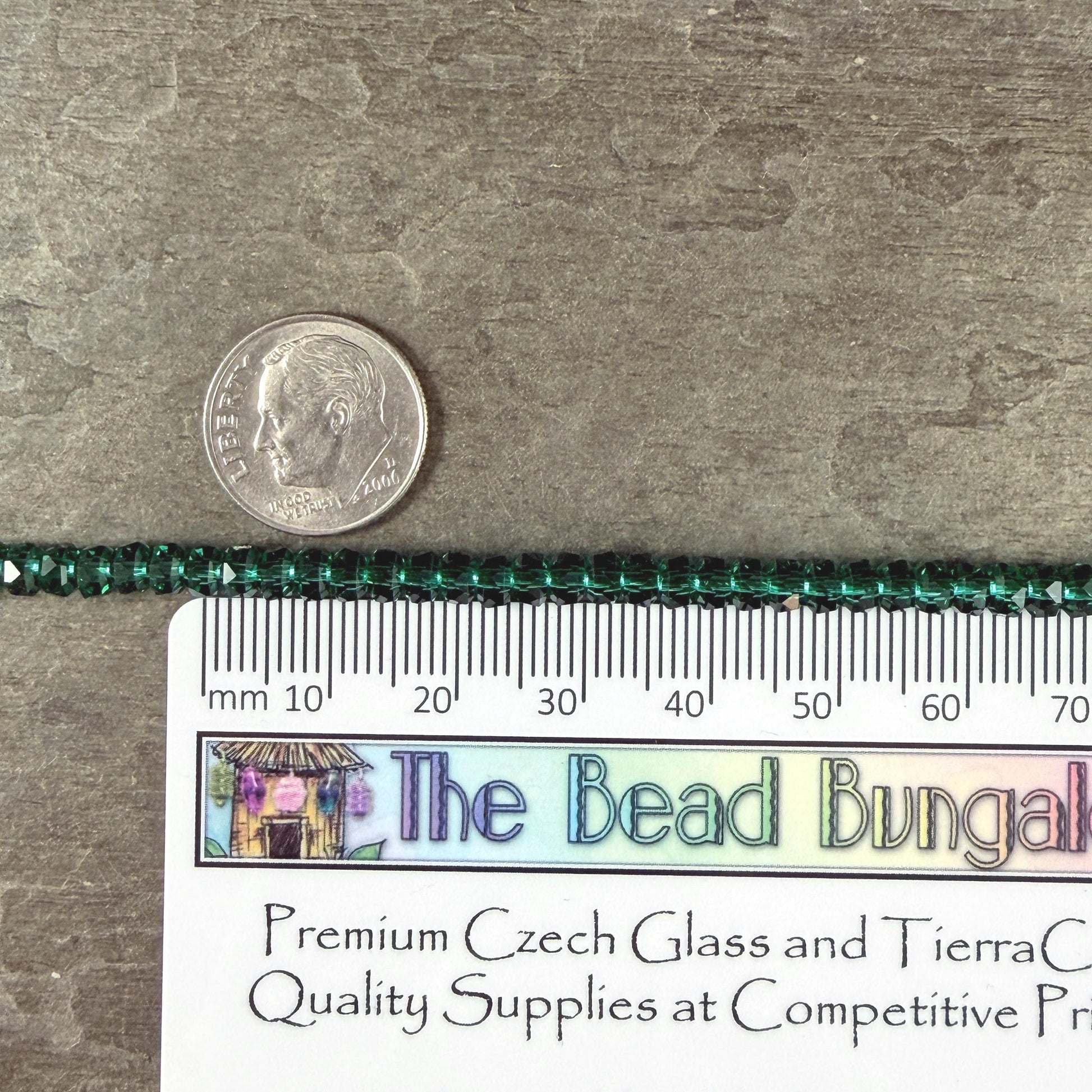 Faceted Glass Beads - 4x2.5mm Heishi Rondelles, Transparent Emerald Green (C539) * 8" Strand