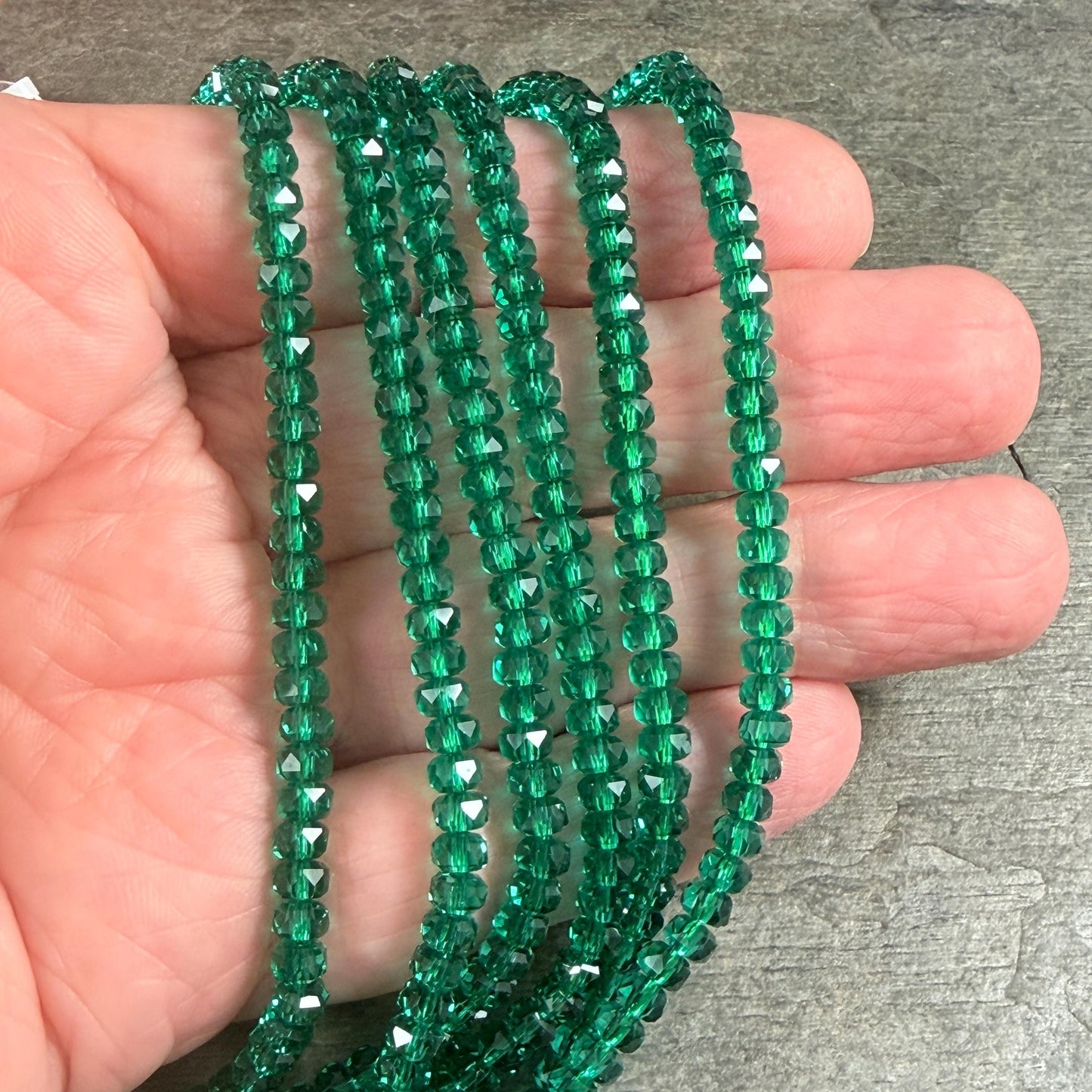Faceted Glass Beads - 4x2.5mm Heishi Rondelles, Transparent Emerald Green (C539) * 8" Strand