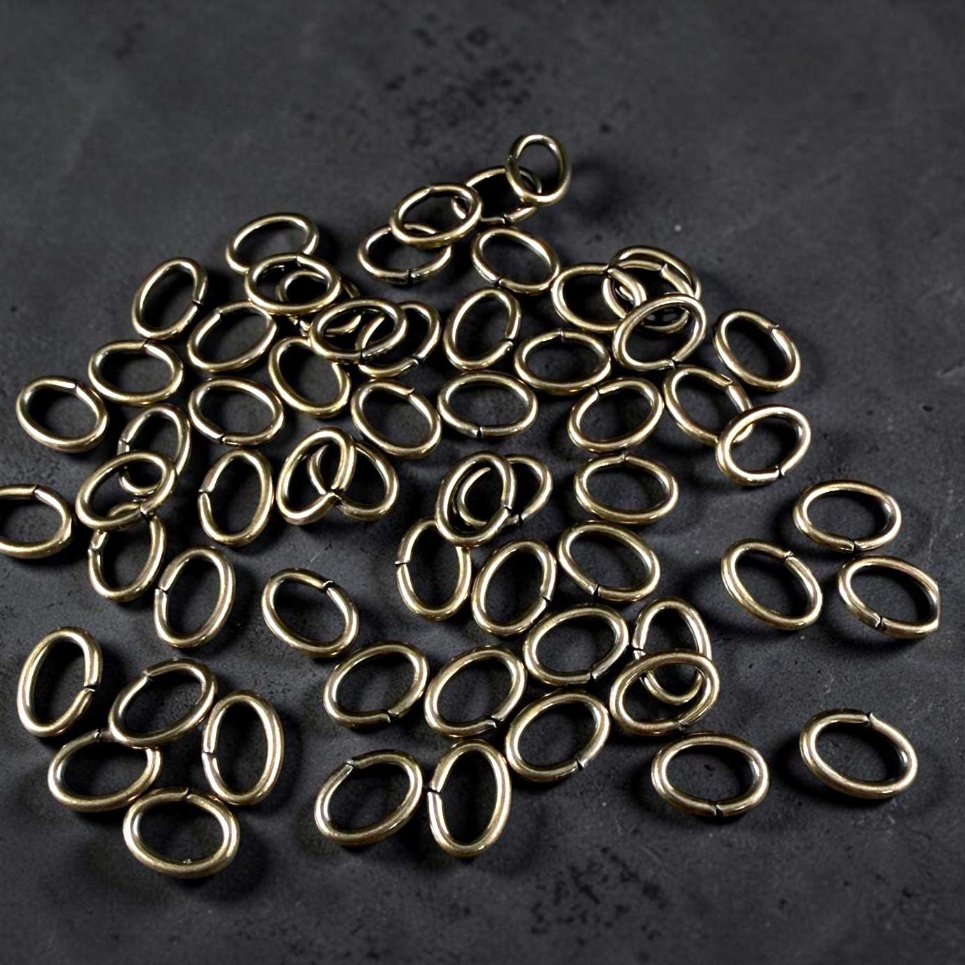 8x6mm Oval Jump Rings, 16g Open, Antiqued Brass (FMG/5083) * Qty. 50