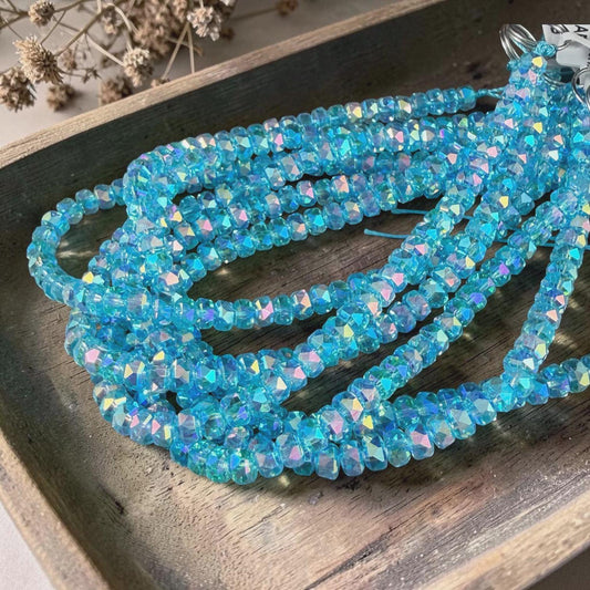 Faceted Glass Beads - 4x2.5mm Heishi Rondelles, Transparent Turquoise with Rainbow AB Finish (C12-AB) * 8" Strand