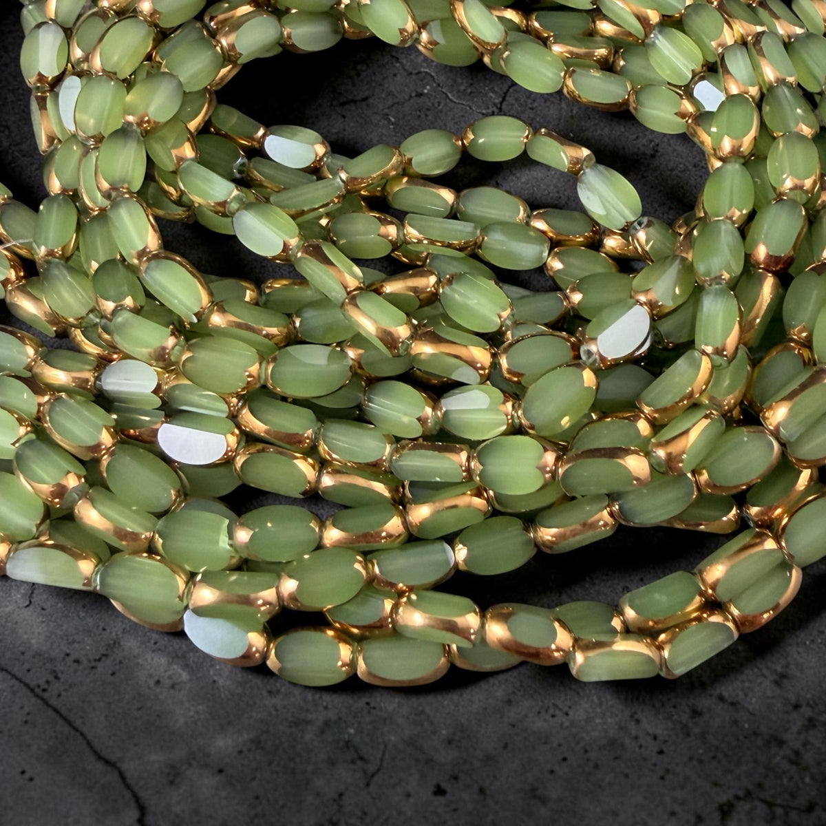 Electroplated Glass Beads - 7x4.5mm Faceted Oval, Milky Peridot Green with Gold Finish (A01-02A) * Qty. 50 Beads