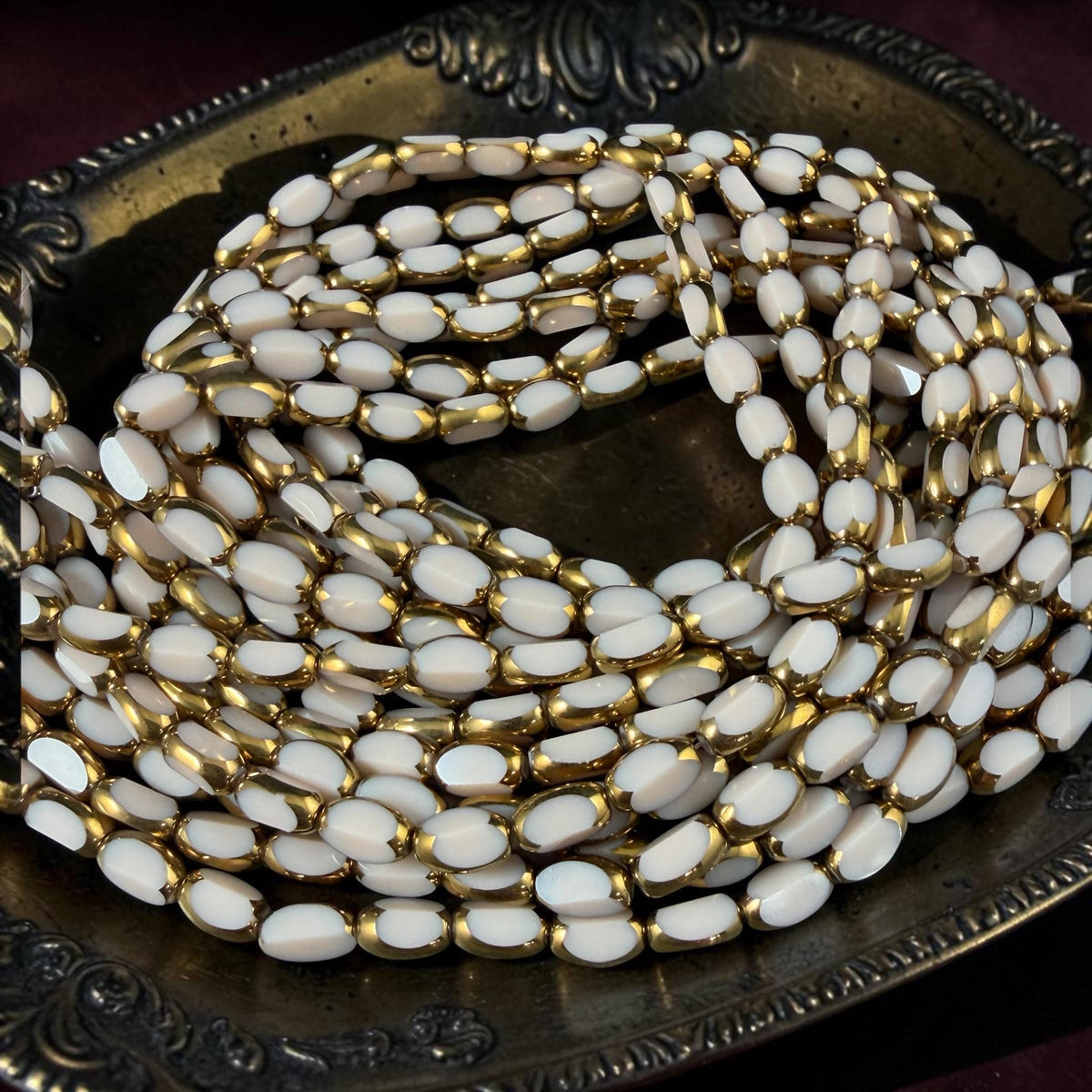 Electroplated Glass Beads - 7x4.5mm Faceted Oval, Opaque Ivory Beige with Gold Finish (A01-02J) * Qty. 50 Beads