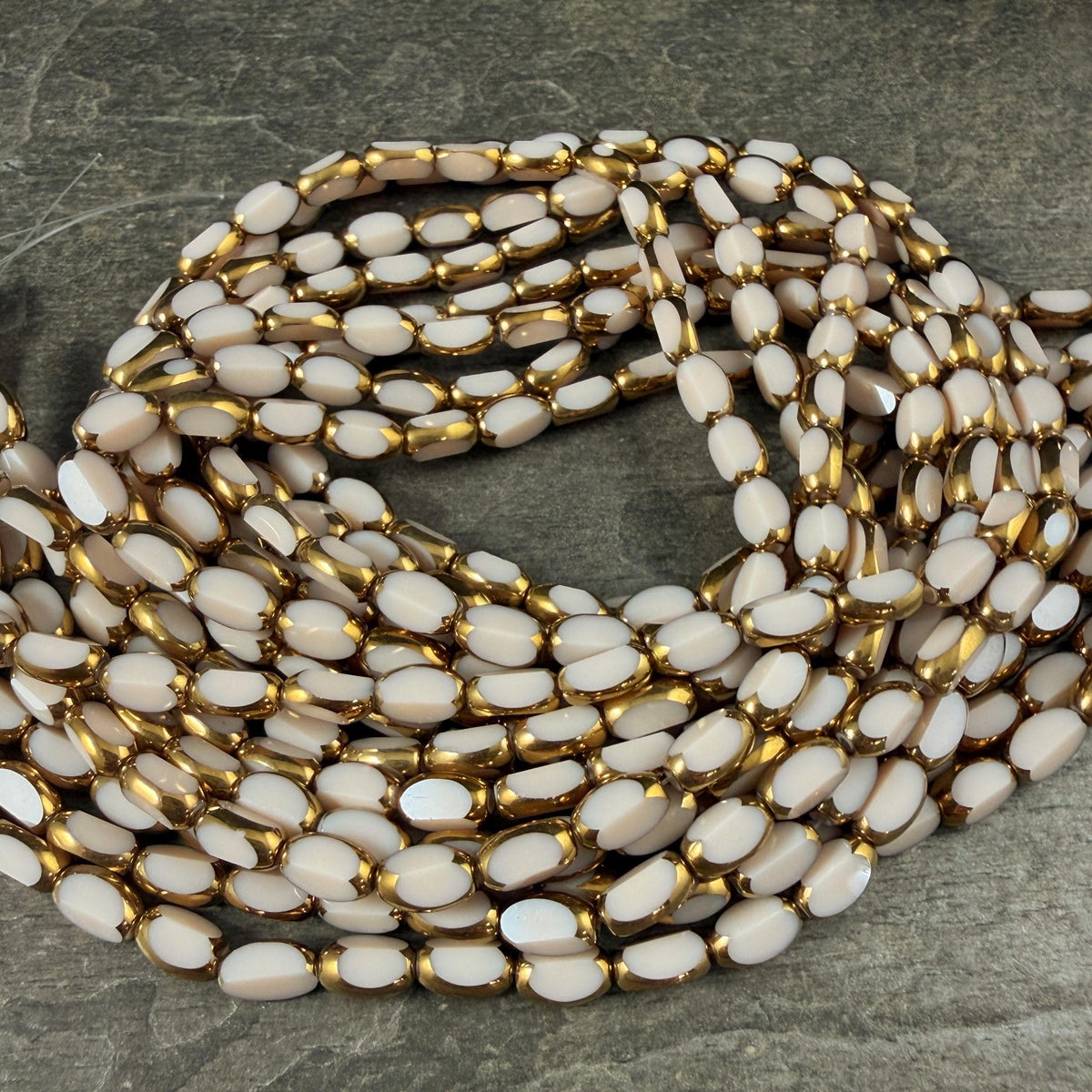 Electroplated Glass Beads - 7x4.5mm Faceted Oval, Opaque Ivory Beige with Gold Finish (A01-02J) * Qty. 50 Beads