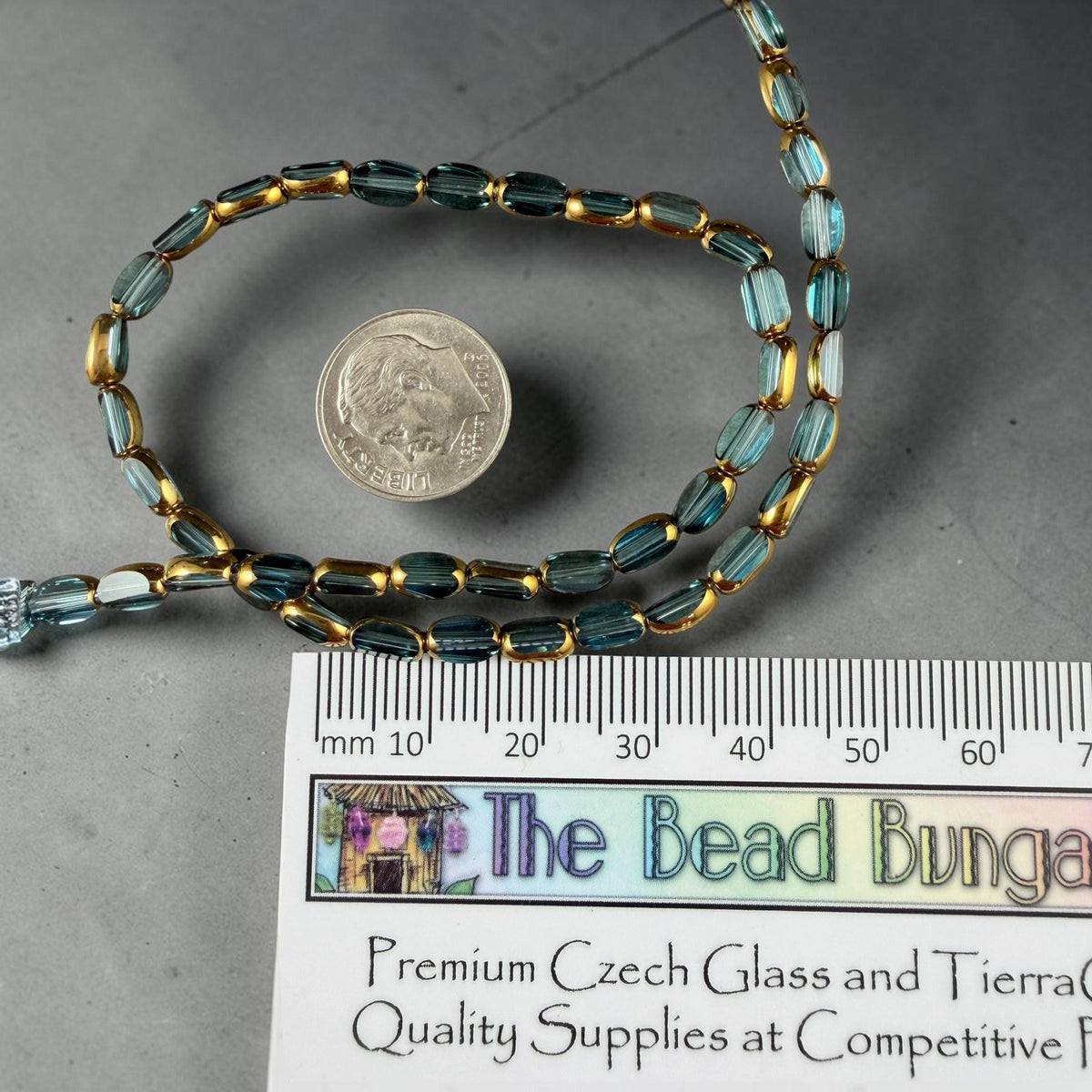 Electroplated Glass Beads - 7x4.5mm Faceted Oval, Transparent Lagoon Blue with Gold Finish (A01-01B) * Qty. 50 Beads