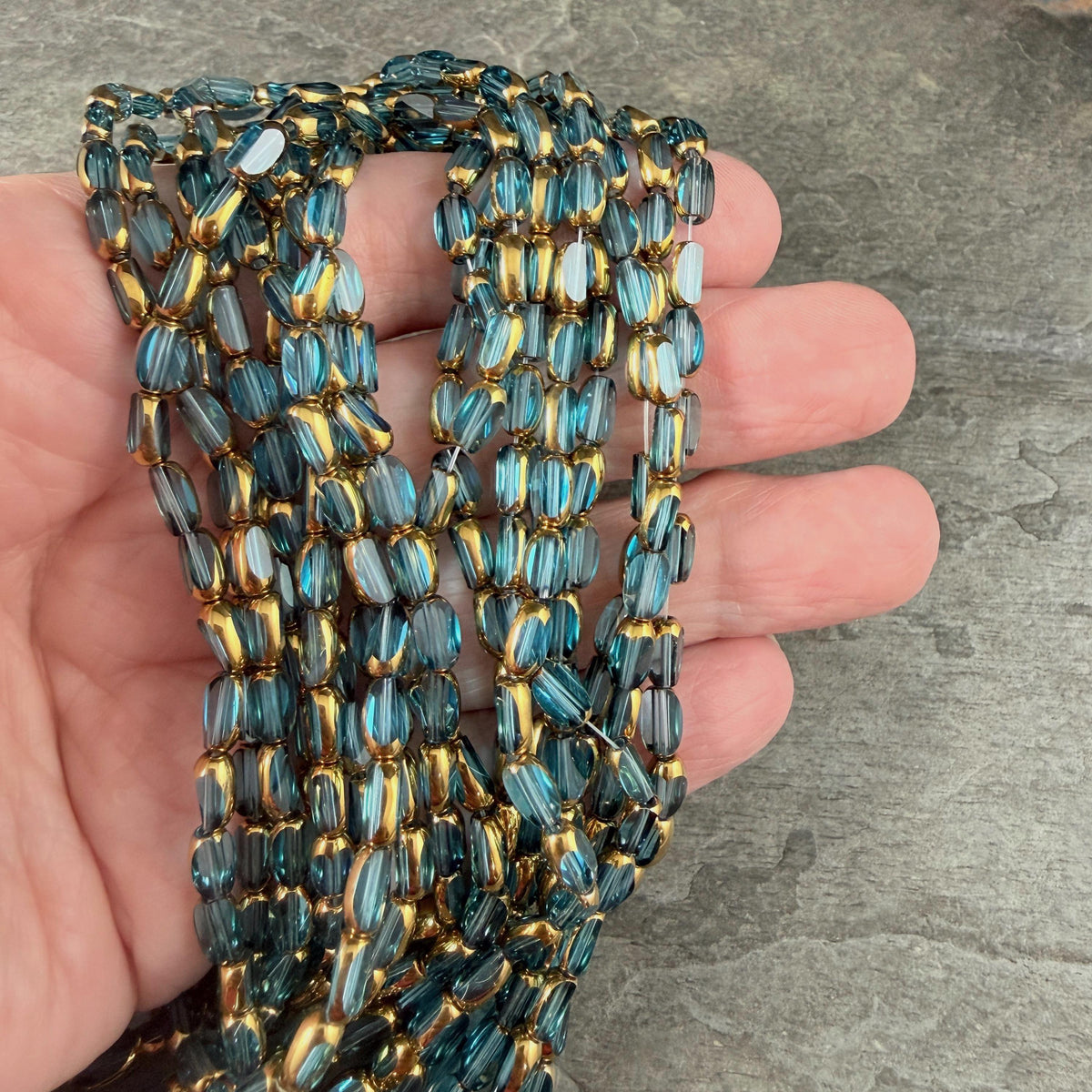 Electroplated Glass Beads - 7x4.5mm Faceted Oval, Transparent Lagoon Blue with Gold Finish (A01-01B) * Qty. 50 Beads