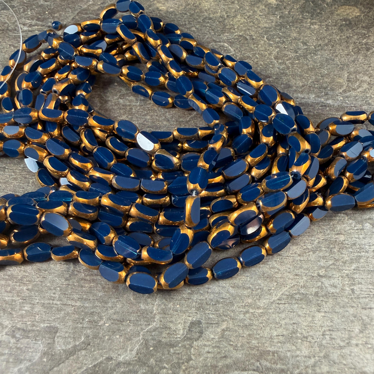 Electroplated Glass Beads - 7x4.5mm Faceted Oval, Opaque Navy Blue with Gold Finish (02A-09) * Qty. 50 Beads