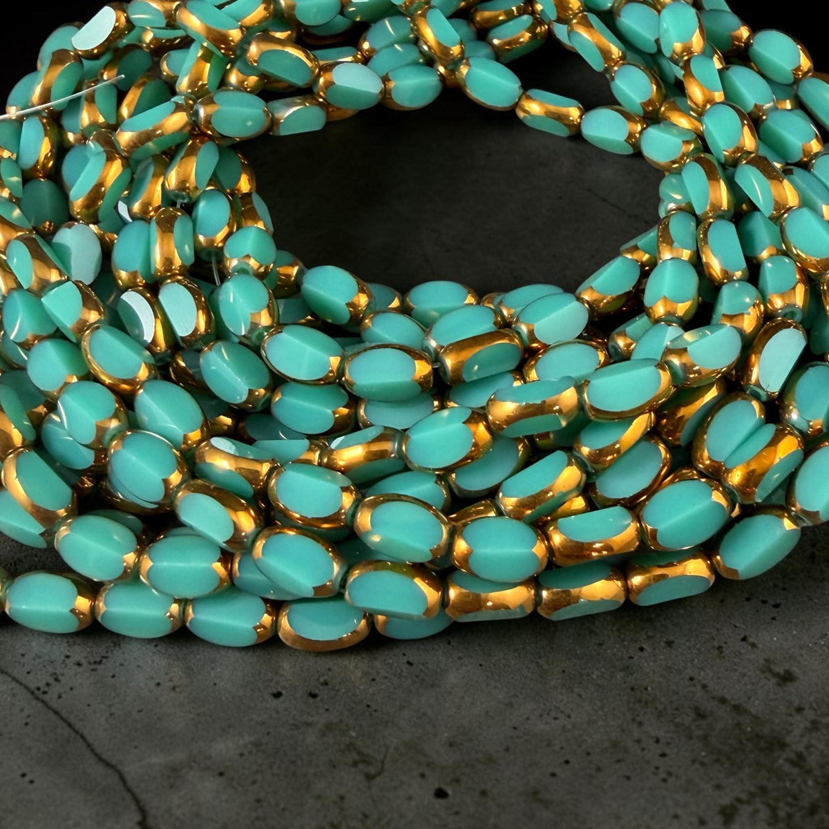 Electroplated Glass Beads - 7x4.5mm Faceted Oval, Opaque Dark Turquoise with Gold Finish (02A-04) * Qty. 50 Beads