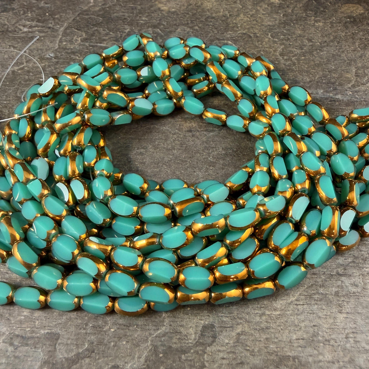 Electroplated Glass Beads - 7x4.5mm Faceted Oval, Opaque Dark Turquoise with Gold Finish (02A-04) * Qty. 50 Beads