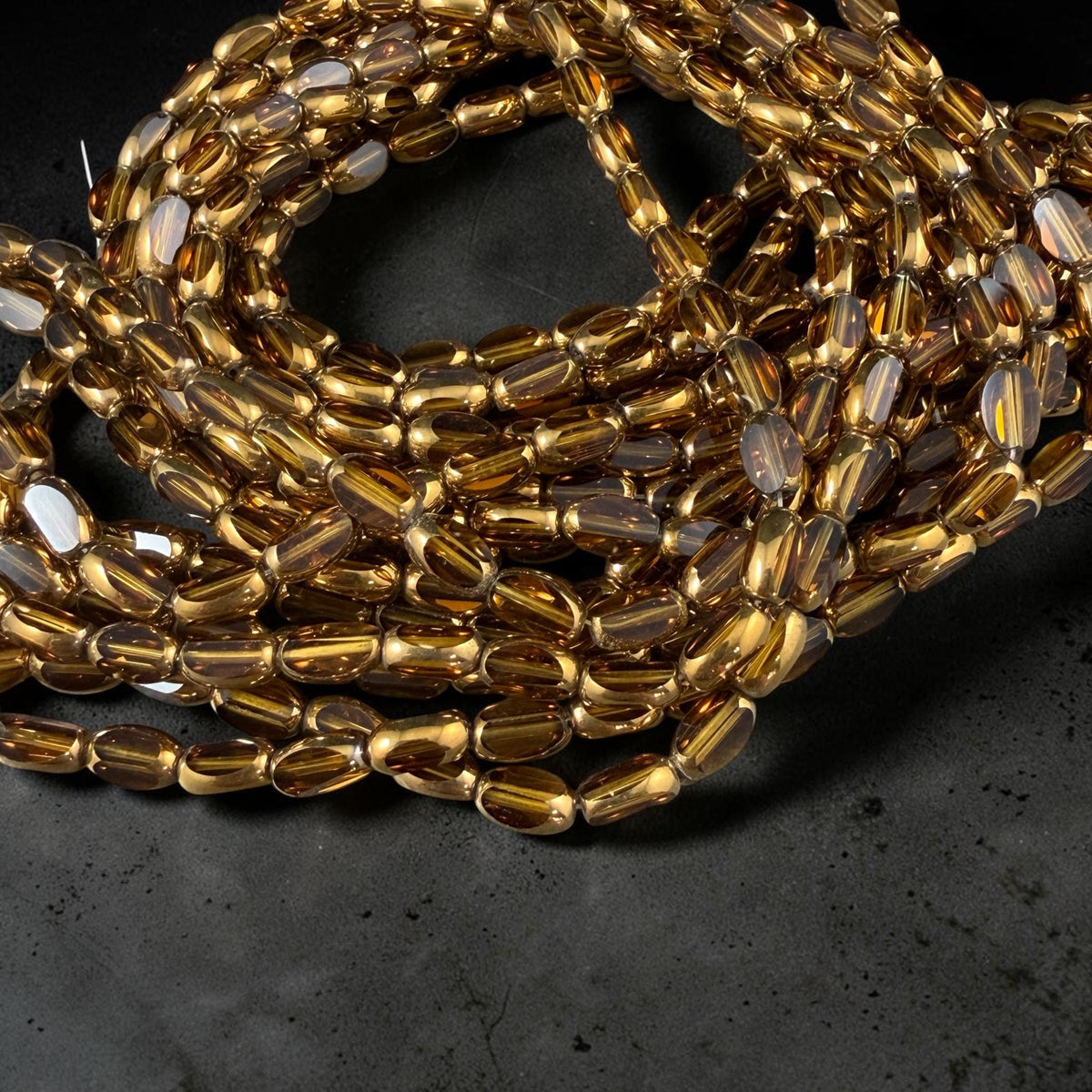 Electroplated Glass Beads - 7x4.5mm Faceted Oval, Transparent Brown with Gold Finish (A01-01E) * Qty. 50 Beads
