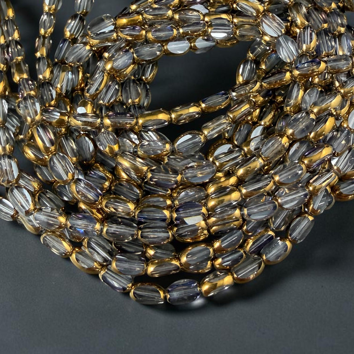 Electroplated Glass Beads - 7x4.5mm Faceted Oval, Transparent Clear with Gold Finish (A01-01A) * Qty. 50 Beads