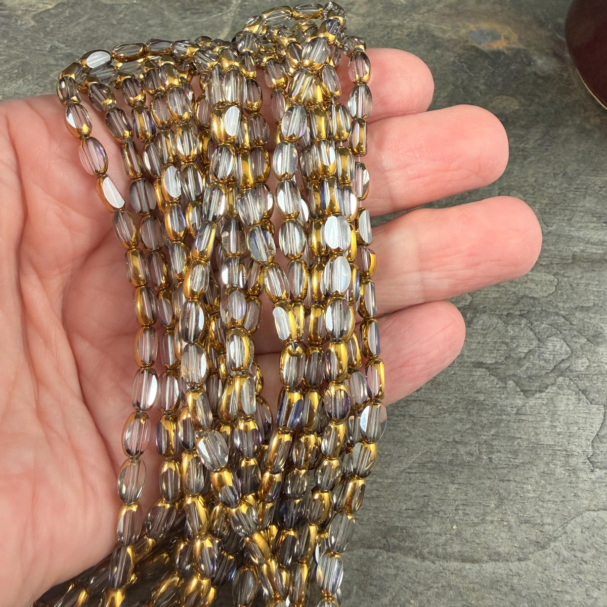 Electroplated Glass Beads - 7x4.5mm Faceted Oval, Transparent Clear with Gold Finish (A01-01A) * Qty. 50 Beads