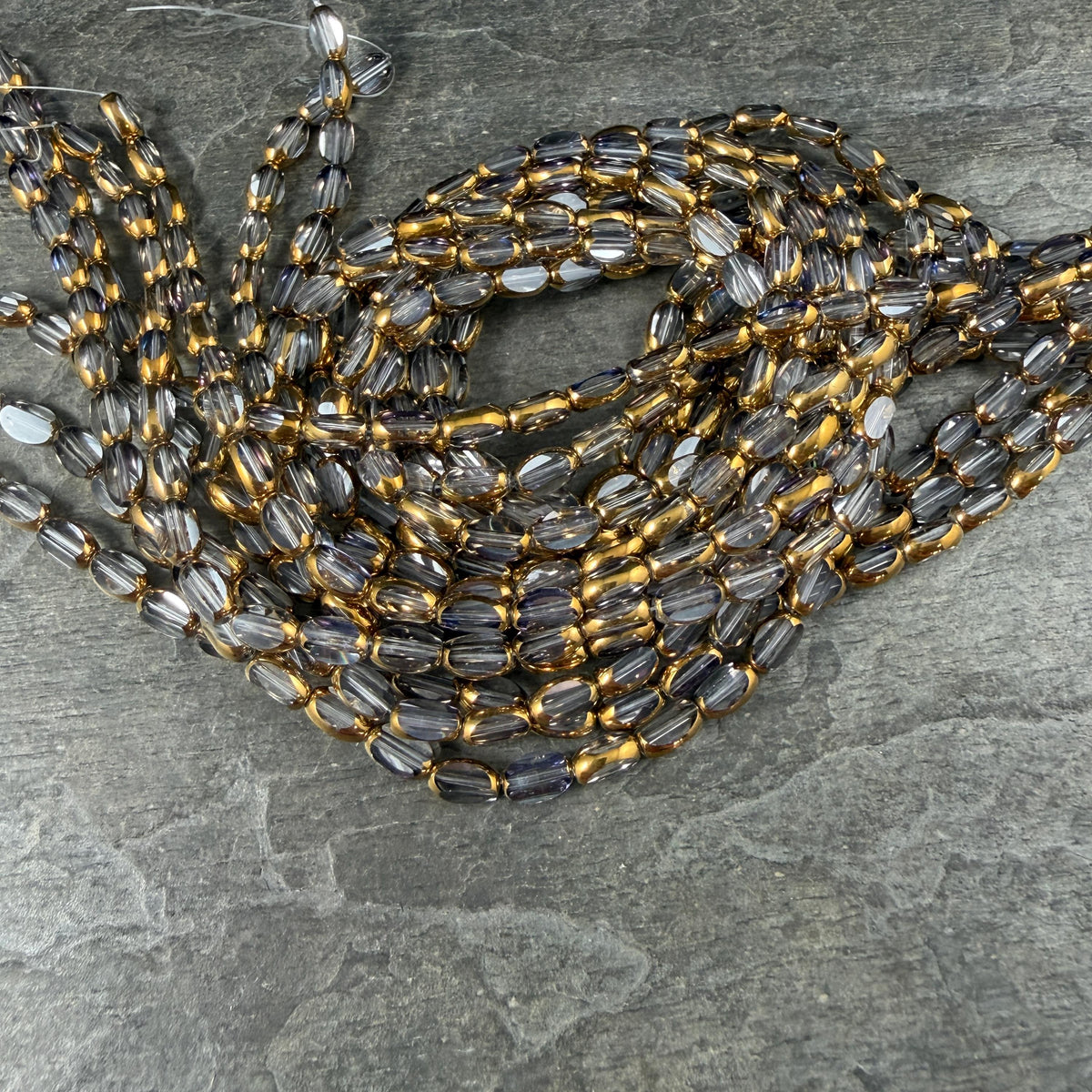 Electroplated Glass Beads - 7x4.5mm Faceted Oval, Transparent Clear with Gold Finish (A01-01A) * Qty. 50 Beads