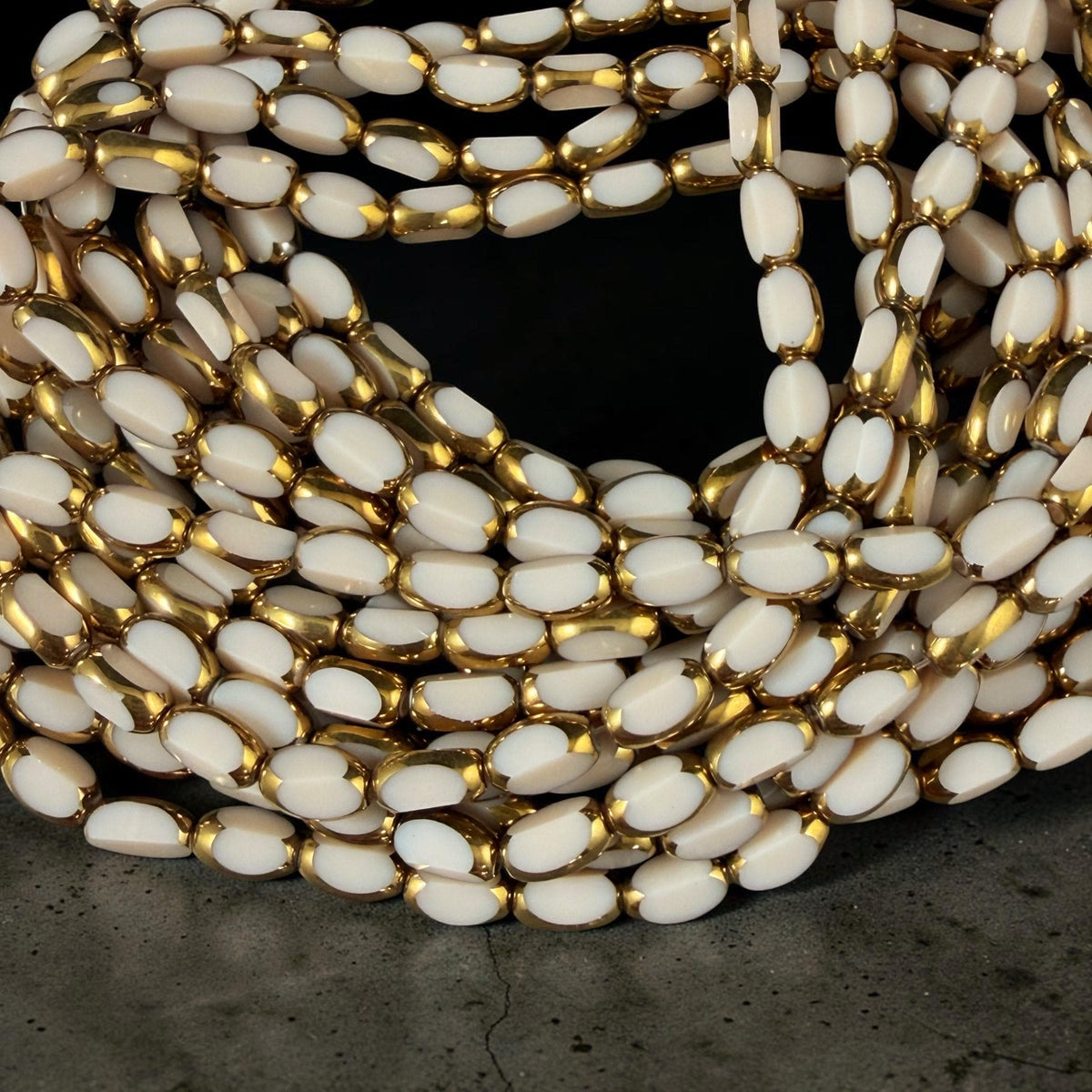 Electroplated Glass Beads - 7x4.5mm Faceted Oval, Opaque Ivory Beige with Gold Finish (A01-02J) * Qty. 50 Beads