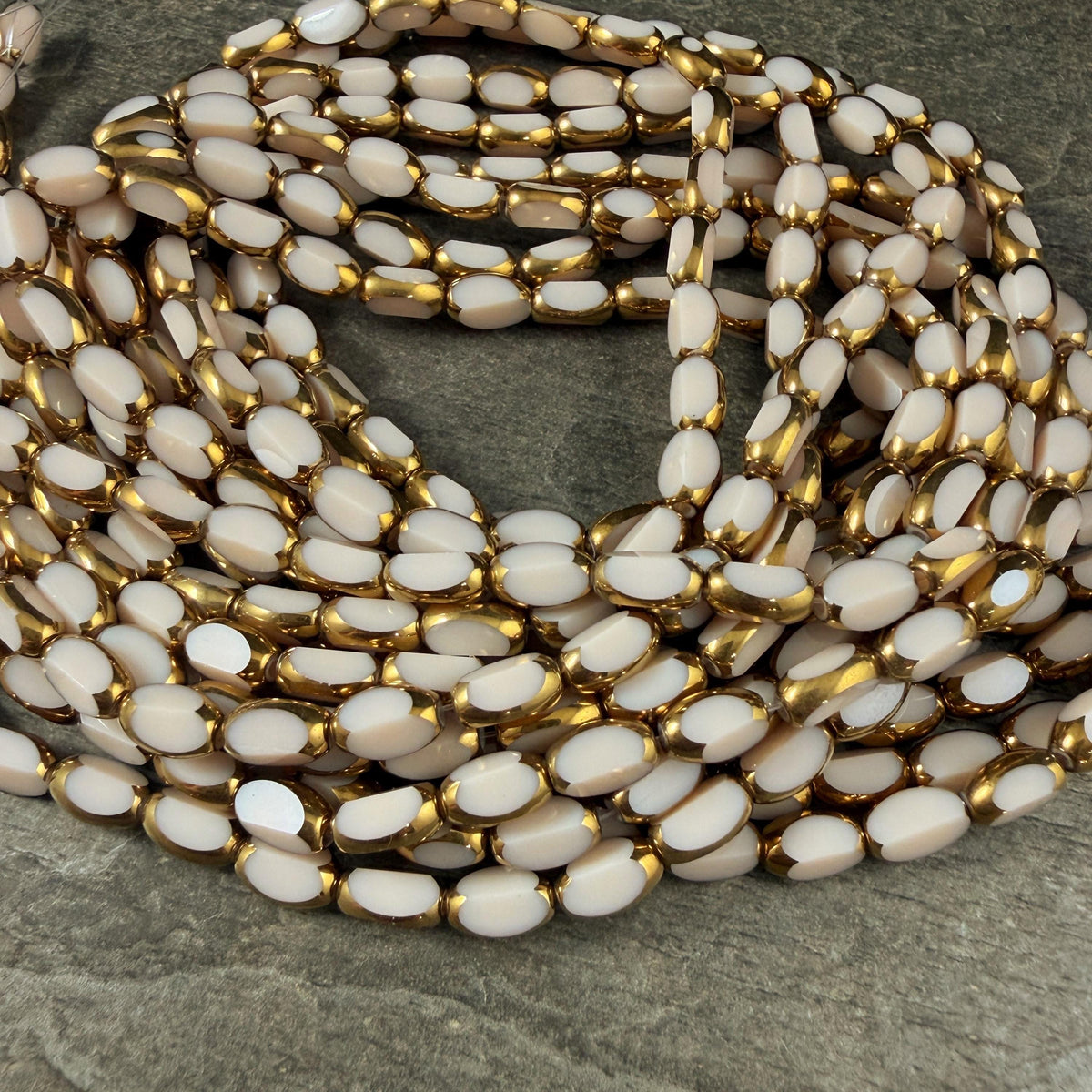 Electroplated Glass Beads - 7x4.5mm Faceted Oval, Opaque Ivory Beige with Gold Finish (A01-02J) * Qty. 50 Beads