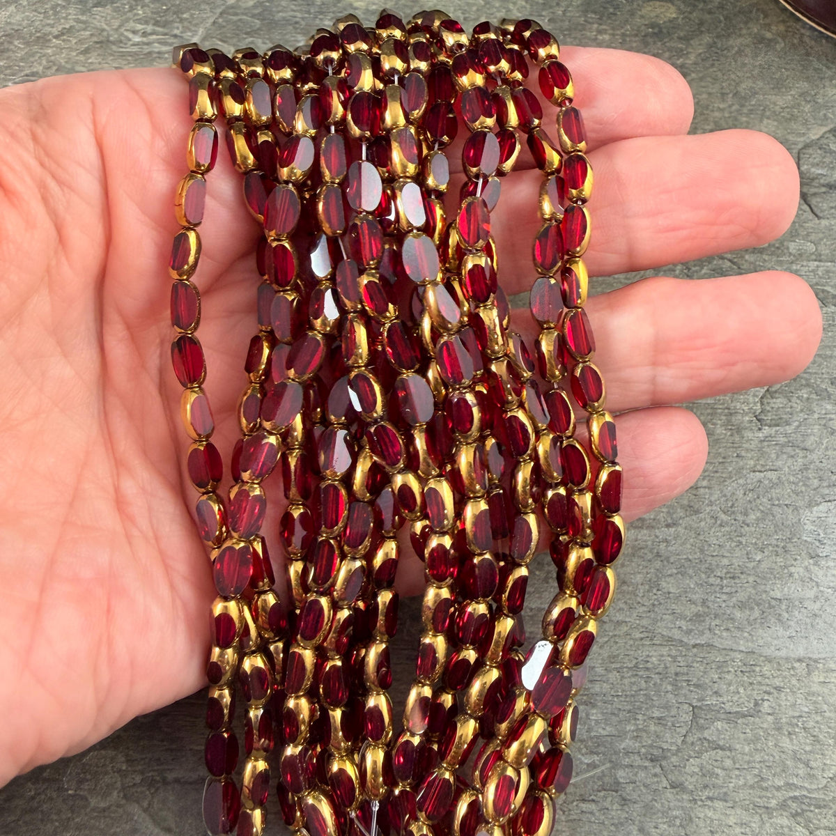 Electroplated Glass Beads - 7x4.5mm Faceted Oval, Transparent Red with Gold Finish (A01-02G) * Qty. 50 Beads
