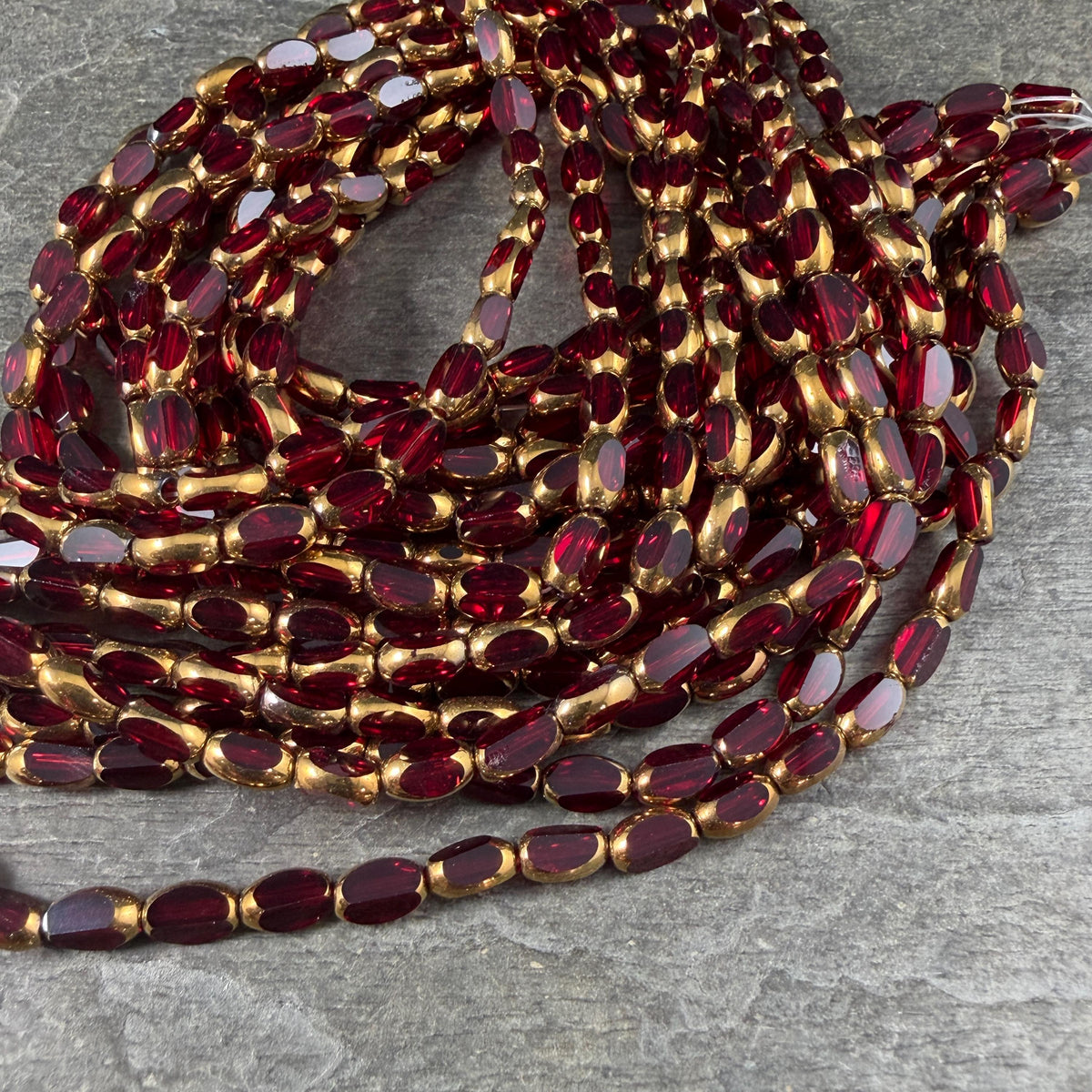Electroplated Glass Beads - 7x4.5mm Faceted Oval, Transparent Red with Gold Finish (A01-02G) * Qty. 50 Beads