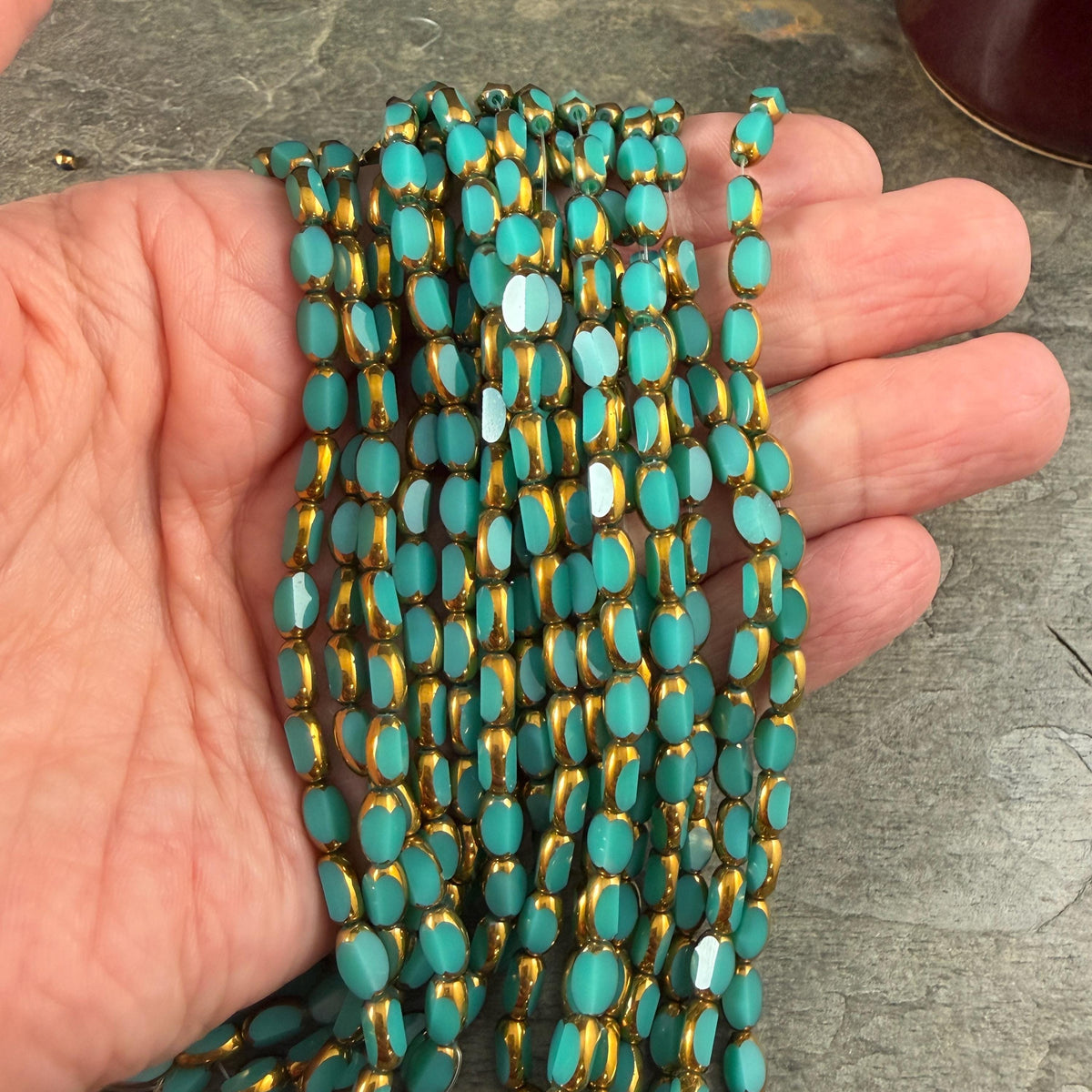 Electroplated Glass Beads - 7x4.5mm Faceted Oval, Opaque Dark Turquoise with Gold Finish (02A-04) * Qty. 50 Beads