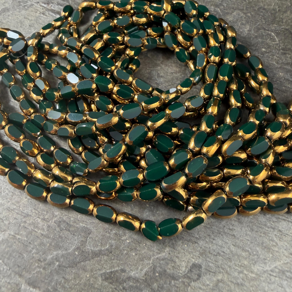 Electroplated Glass Beads - 7x4.5mm Faceted Oval, Opaque Evergreen with Gold Finish (02A-02) * Qty. 50 Beads