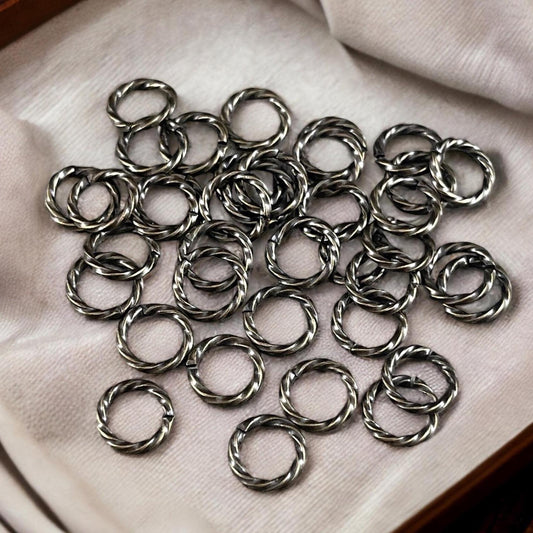 8mm Twisted Jumprings, 16g Open, Antiqued Brass (FMG/5032) * Qty. 100