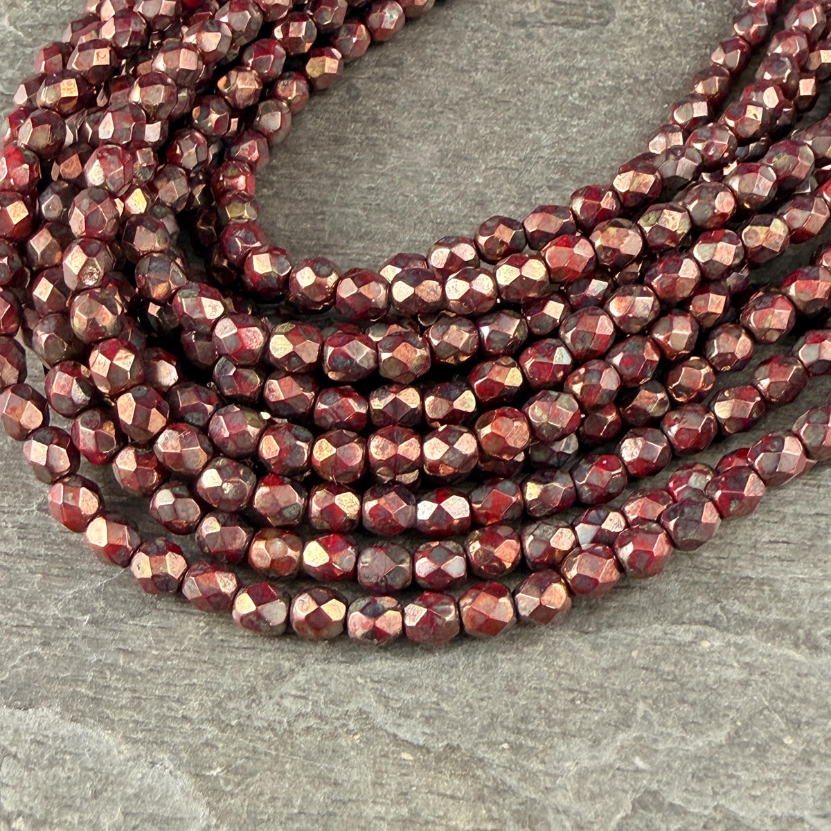 Czech Glass - 4mm Faceted Round Beads, Opaque Red with Bronze Picasso (FP4/SM-BT9320) * Qty 50