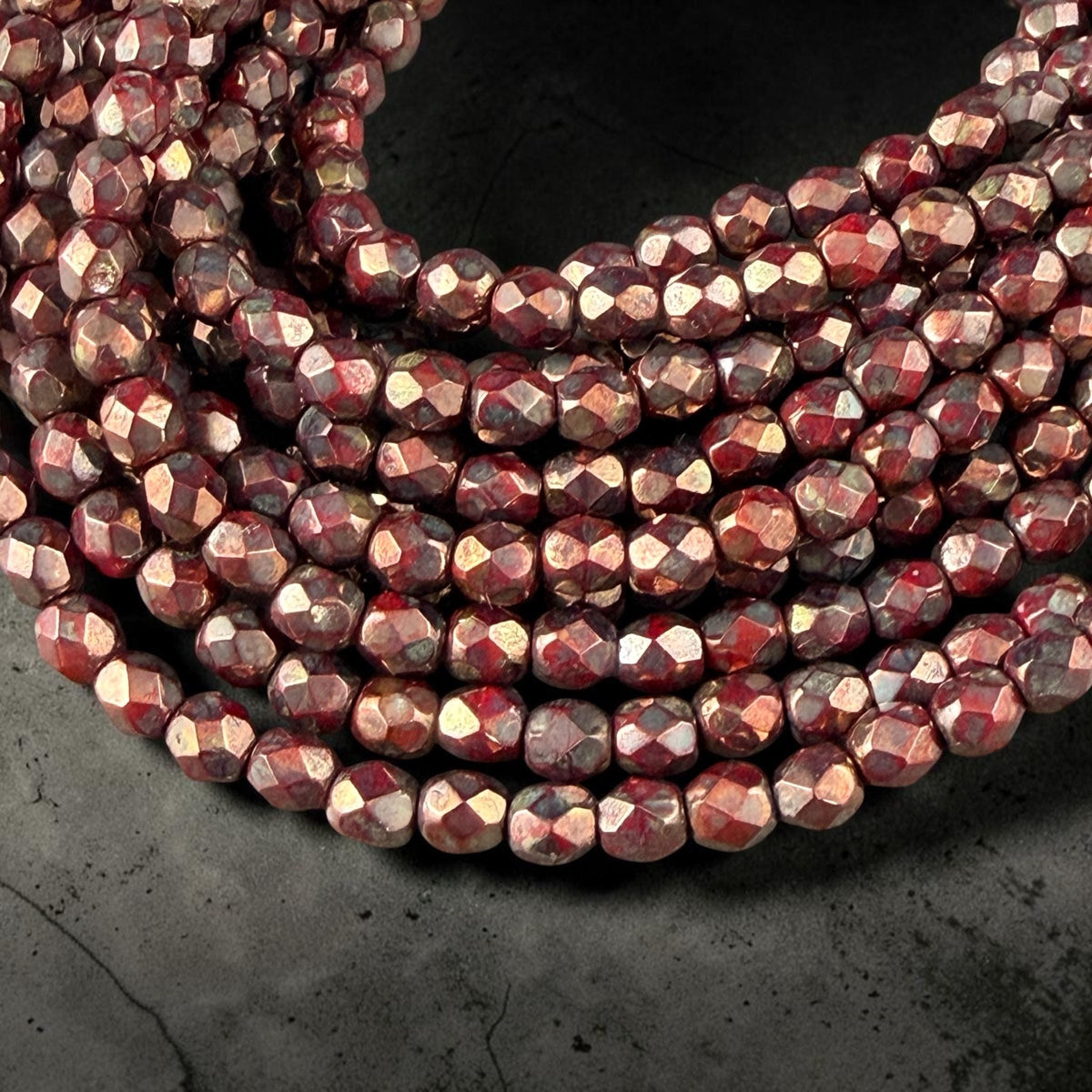 Czech Glass - 4mm Faceted Round Beads, Opaque Red with Bronze Picasso (FP4/SM-BT9320) * Qty 50