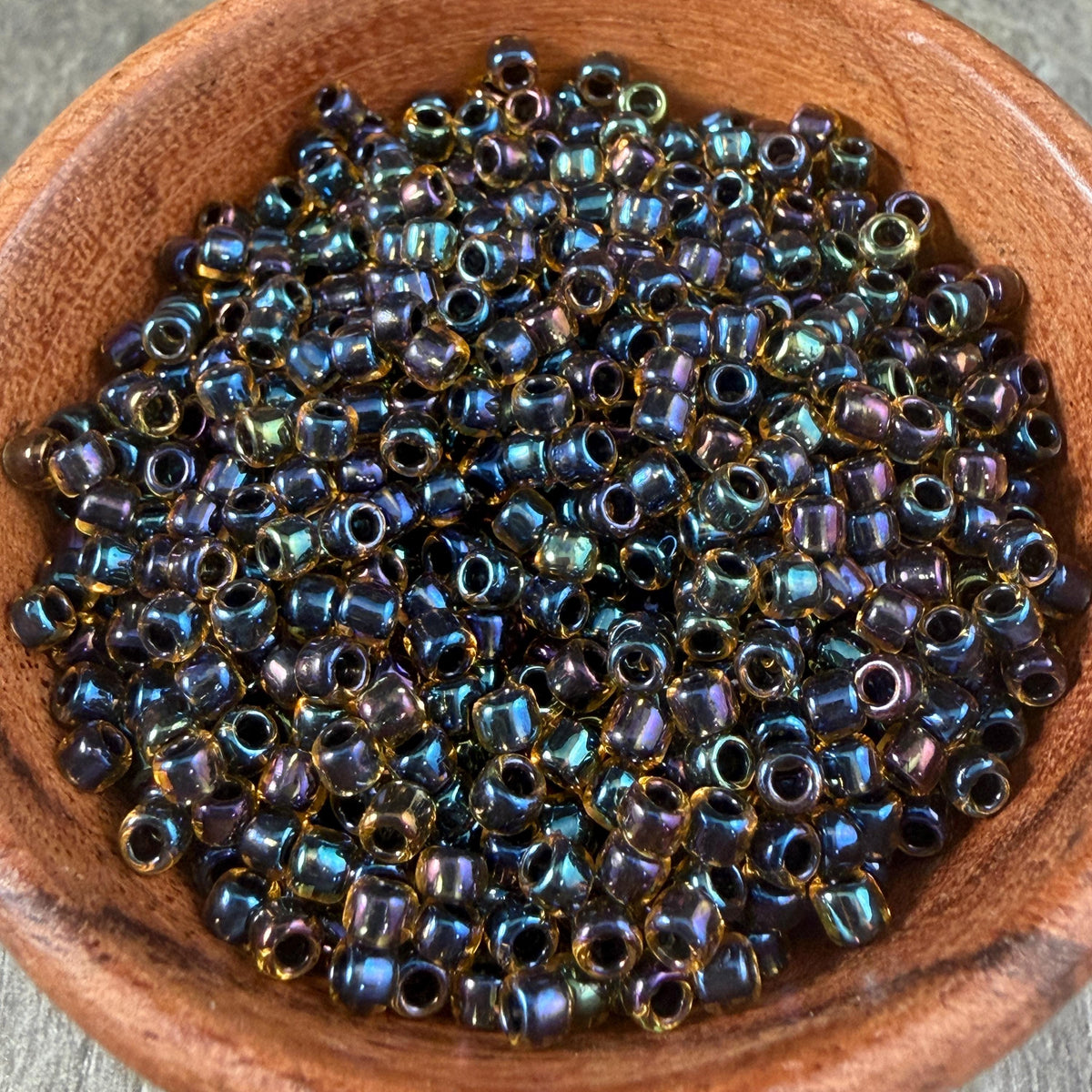 8/0 TOHO Glass Seed Beads, Rainbow Light Topaz, Black Lined (T8/SM-244) * 20 grams