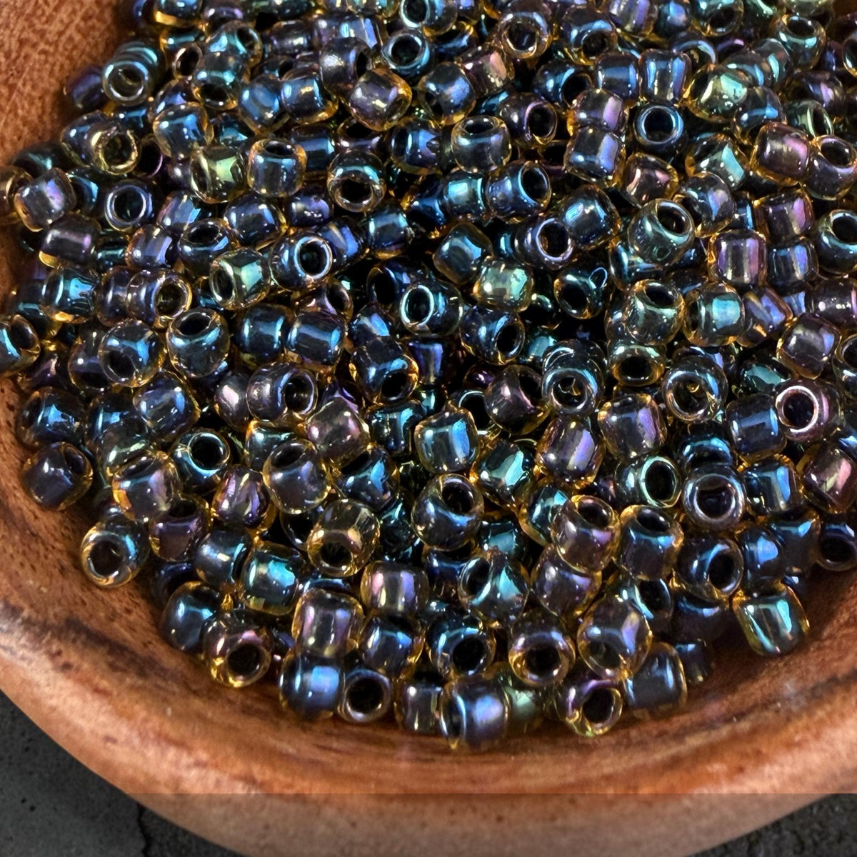 8/0 TOHO Glass Seed Beads, Rainbow Light Topaz, Black Lined (T8/SM-244) * 20 grams
