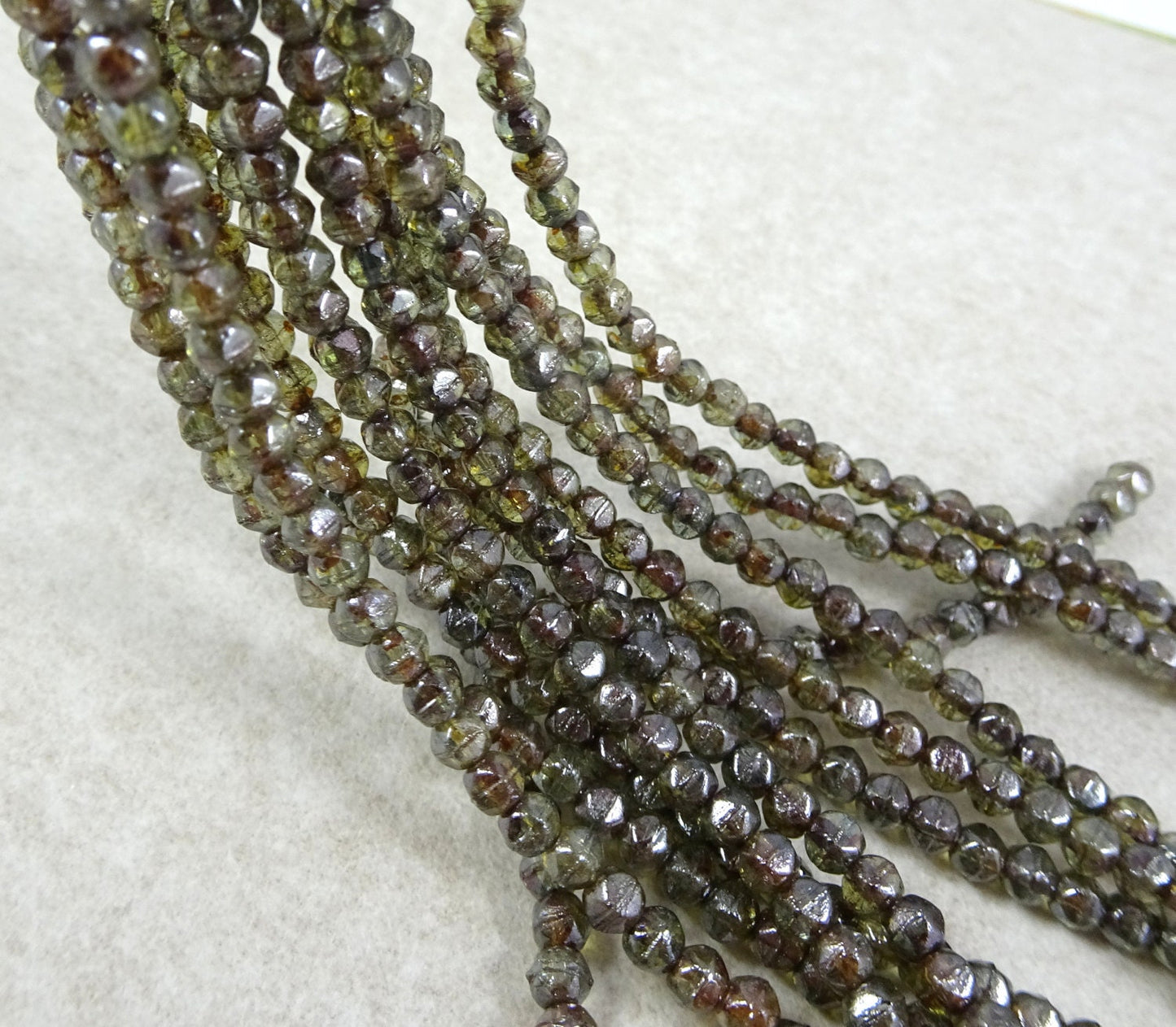 Czech Glass Beads - Transparent Dark Green Luster Czech Beads 3mm English Cut Transparent Green Picasso Luster (EC3/SM-65431) * Qty. 50