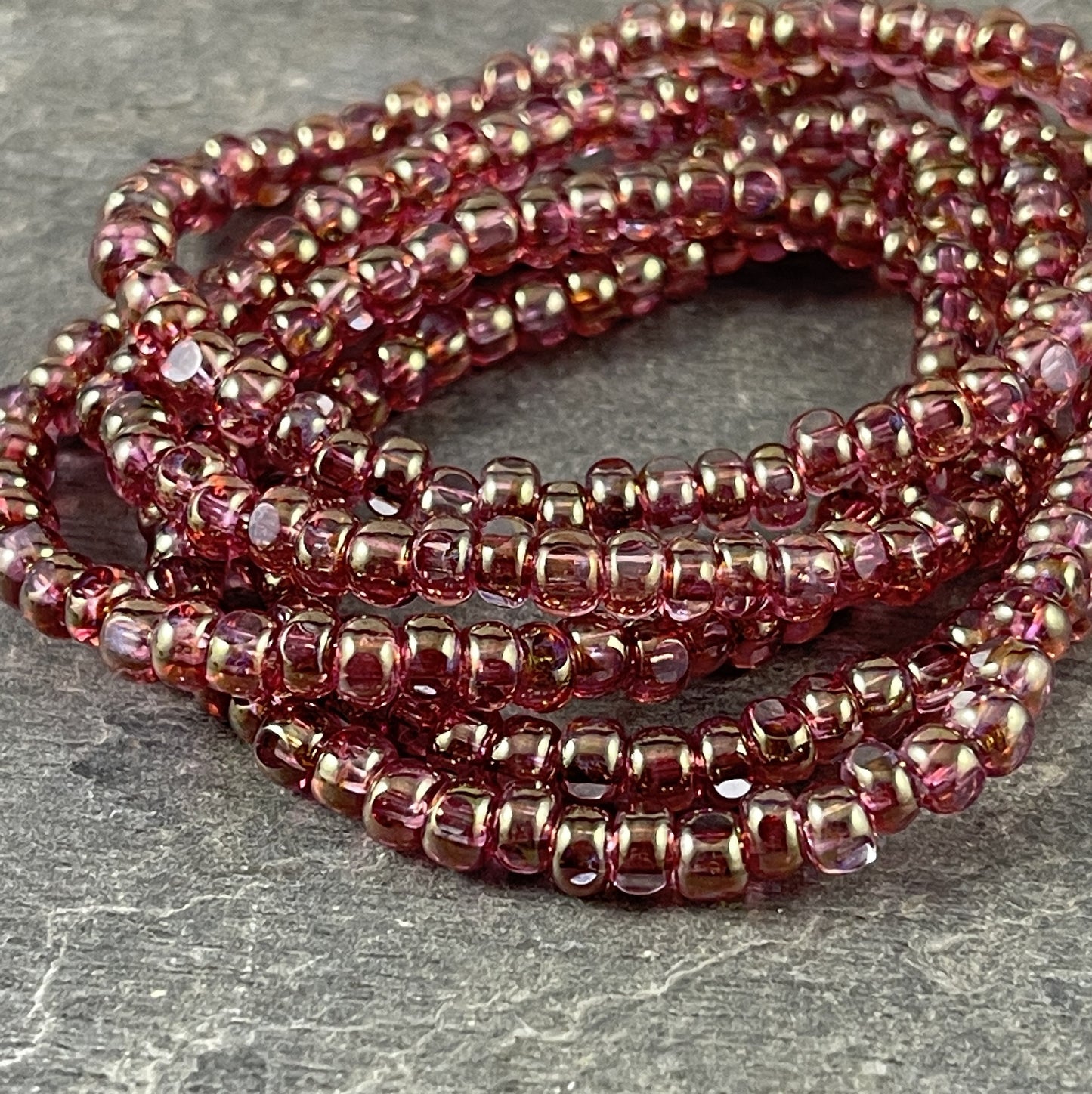 Czech Glass Beads Golden Fuchsia Faceted Seed Bead 4x3mm Transparent Fuchsia with Golden Luster Tri-cut Beads (TRICA/RJ-2630) * Qty. 50