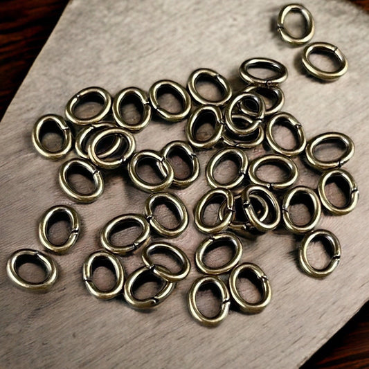 6x4mm Brass Oval Jump Rings ~ 18g Bronze Jump Rings ~ Antiqued Brass Open Jump Rings ~ Oval Shape (FMG/5054) * Qty. 100